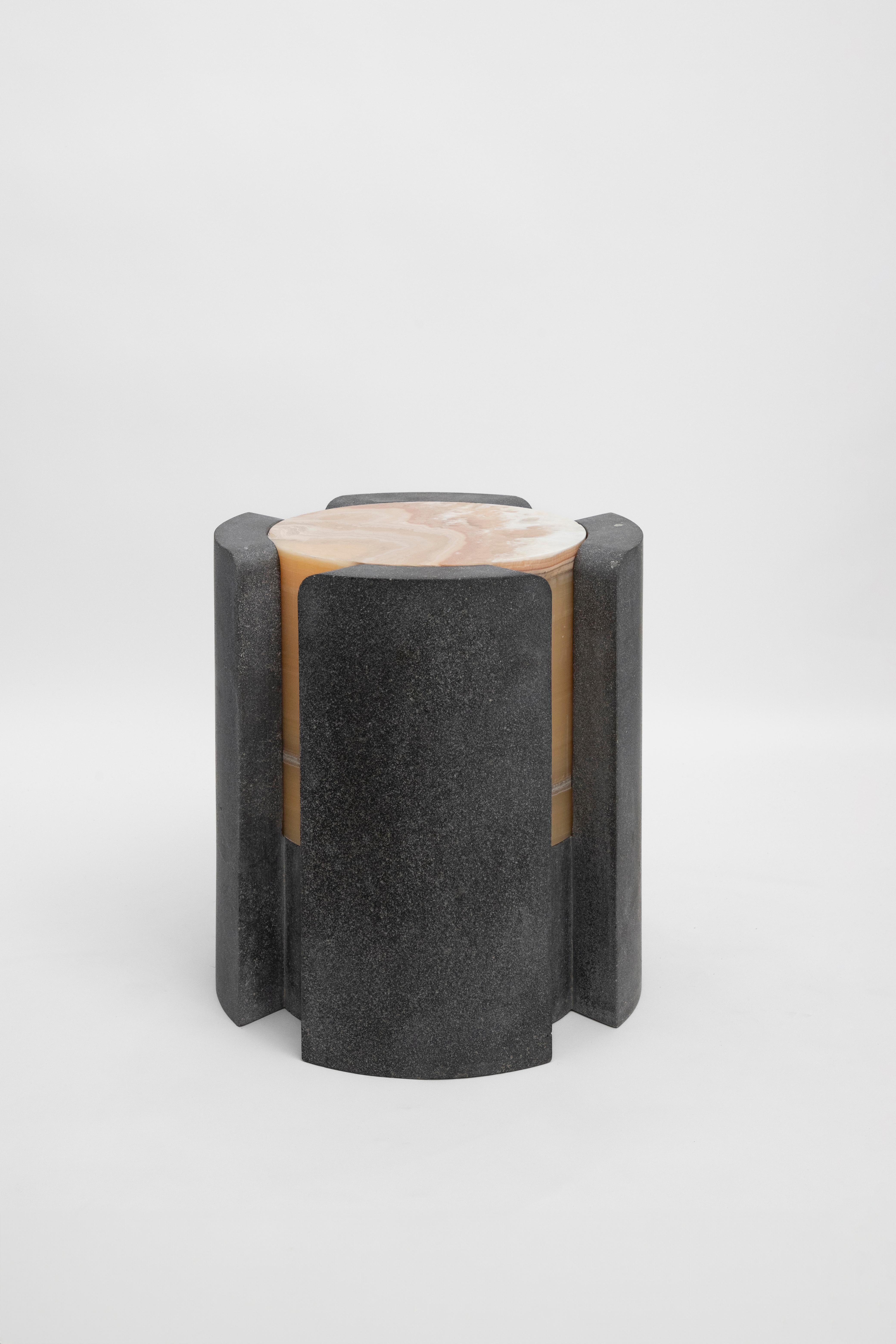 Materials: Lava stone and pineapple onyx
Indoors and outdoors
Side table / Stool

**As this work is made of natural stone, color and veins may vary from the photo**

Through an abstract geometric language where cubes and cylinders playfully