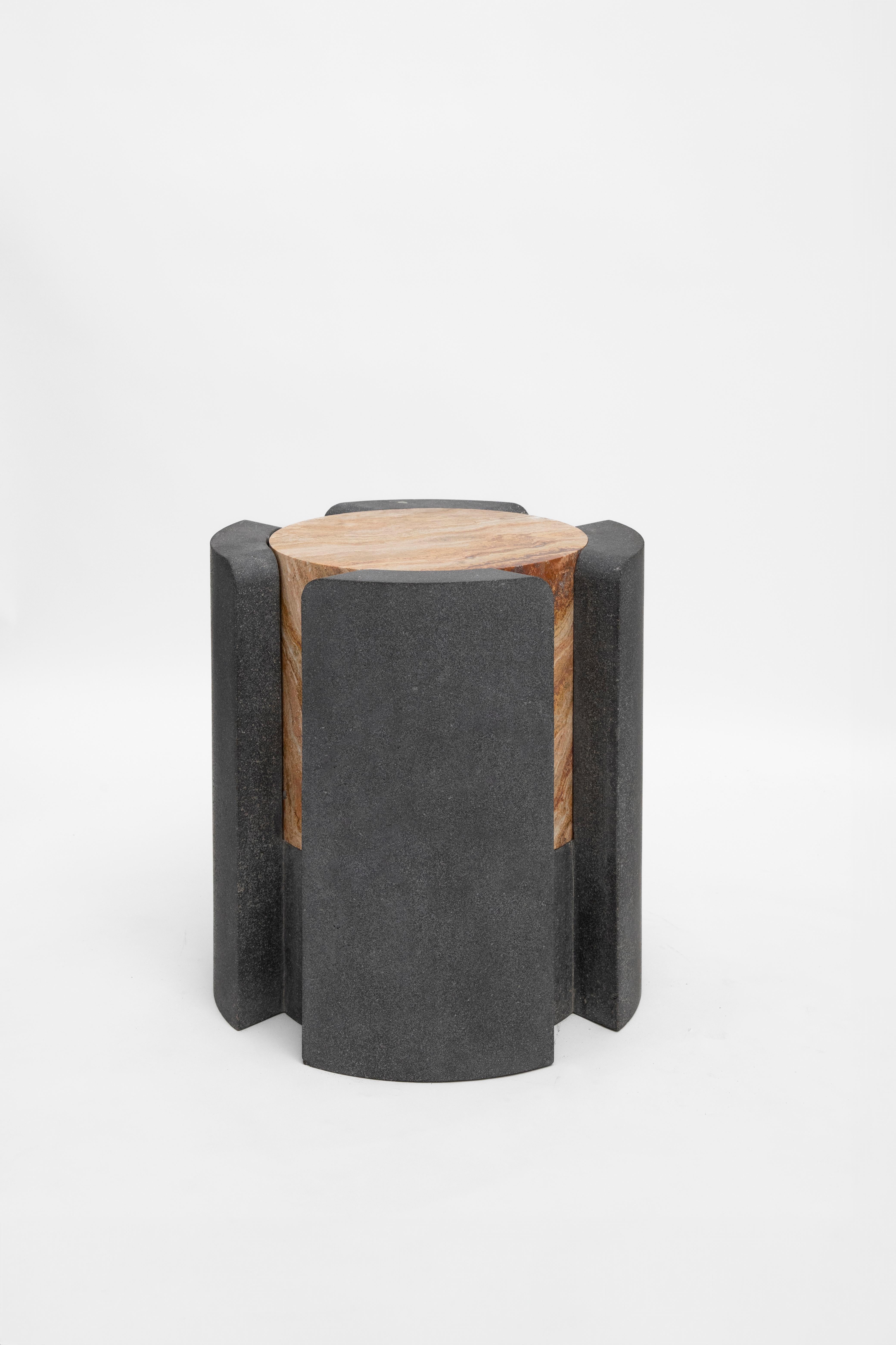 Materials: Lava stone and red travertine
Indoors and outdoors
Side table / Stool

Through an abstract geometric language where cubes and cylinders playfully alternate, these stools represent the millenary connections existing inside the Earth; they
