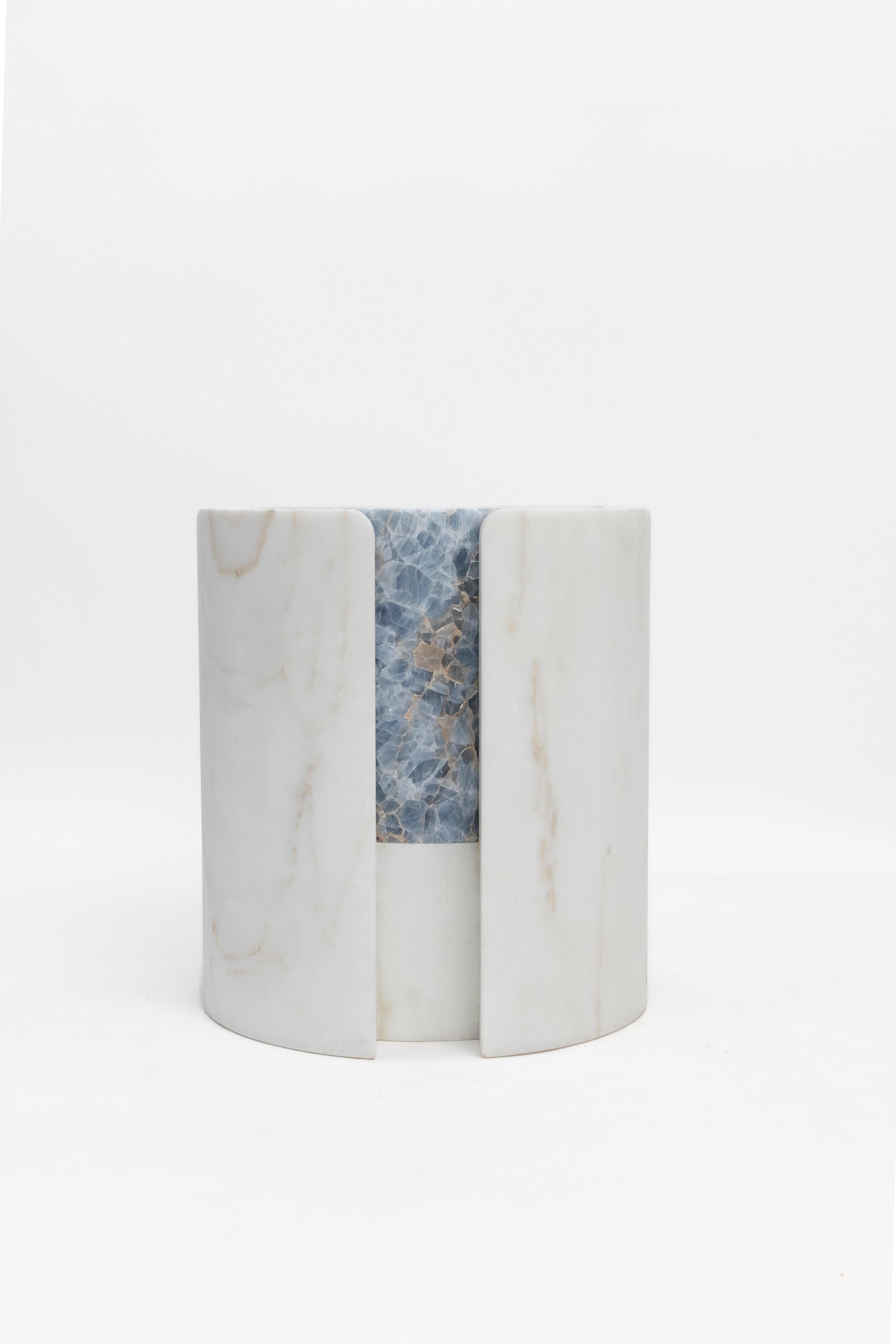 Materials:Golden Calacatta marble and blue calcite
Indoors and outdoors
Side table / Stool

While, in principle, marble bears not a volcanic origin, the veiny, fine-grained Yule marble employed for this variation of Sten Studio’s distinctive stools