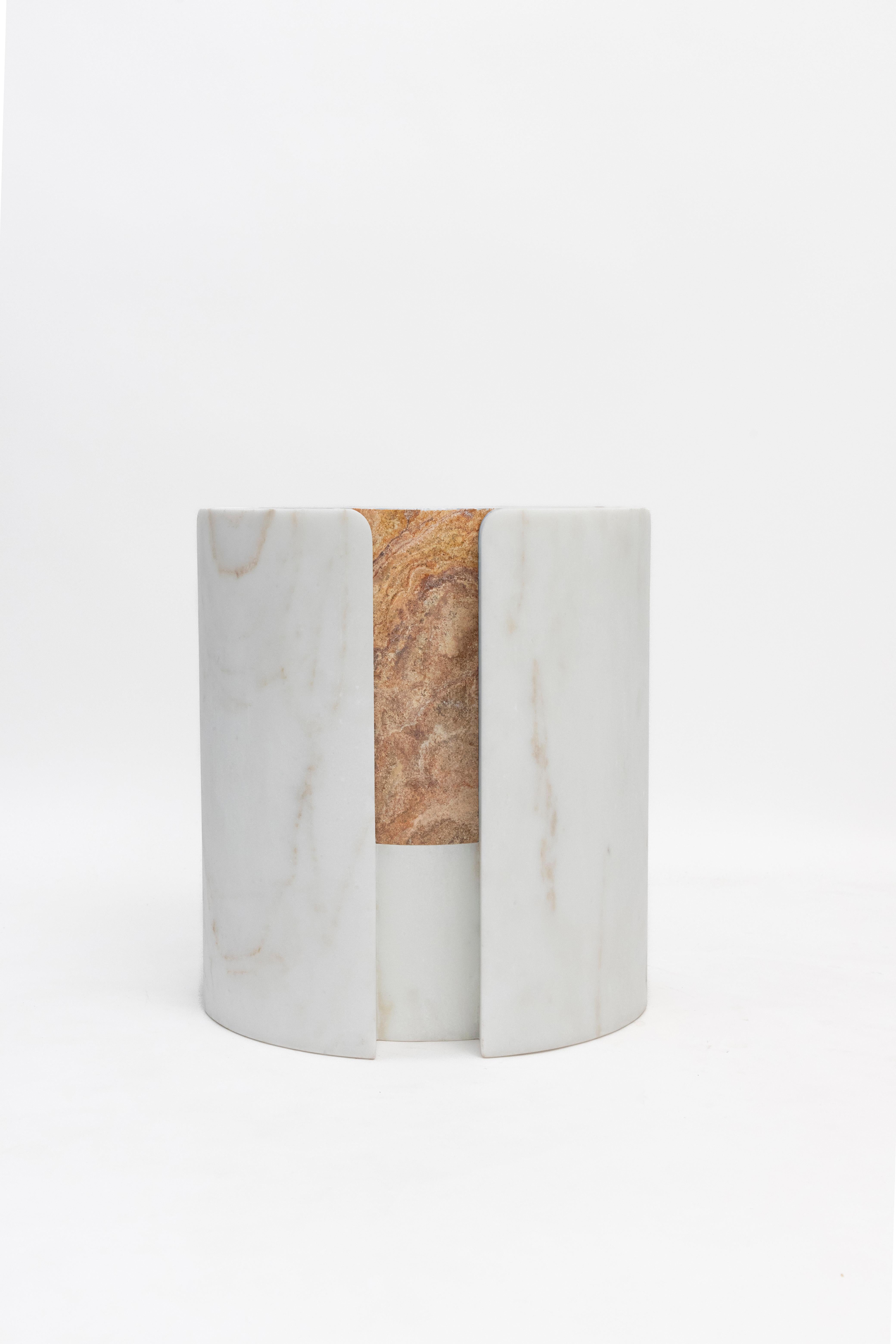 Materials:Golden Calacatta marble and red travertine
Indoors and outdoors
Side table / Stool

While, in principle, marble bears not a volcanic origin, the veiny, fine-grained Yule marble employed for this variation of Sten Studio’s distinctive