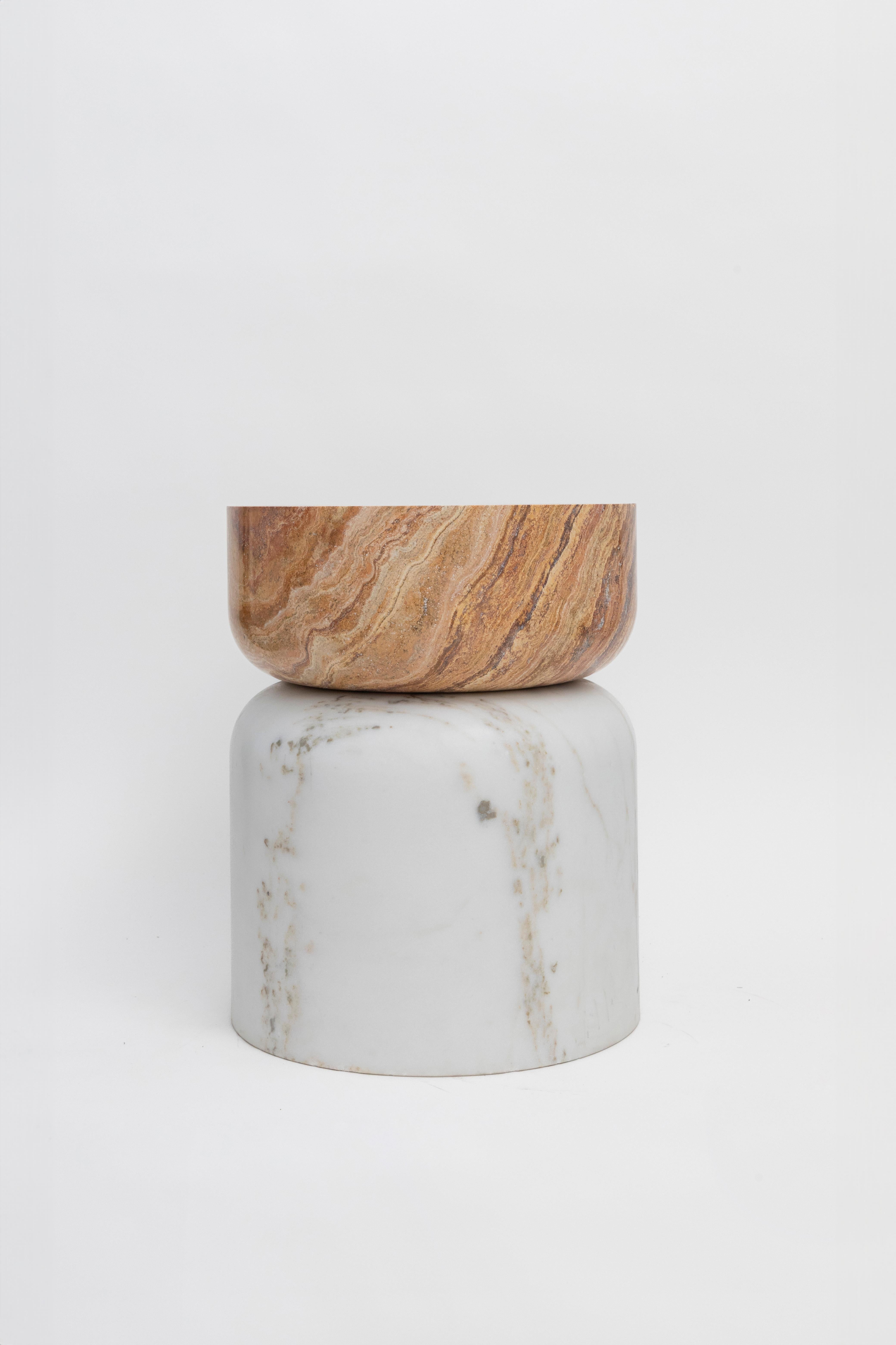 Materials: Golden Calacatta marble and red travertine
Indoors and outdoors
Side table / Stool

While, in principle, marble bears not a volcanic origin, the veiny, fine-grained Yule marble employed for this variation of Sten Studio’s distinctive