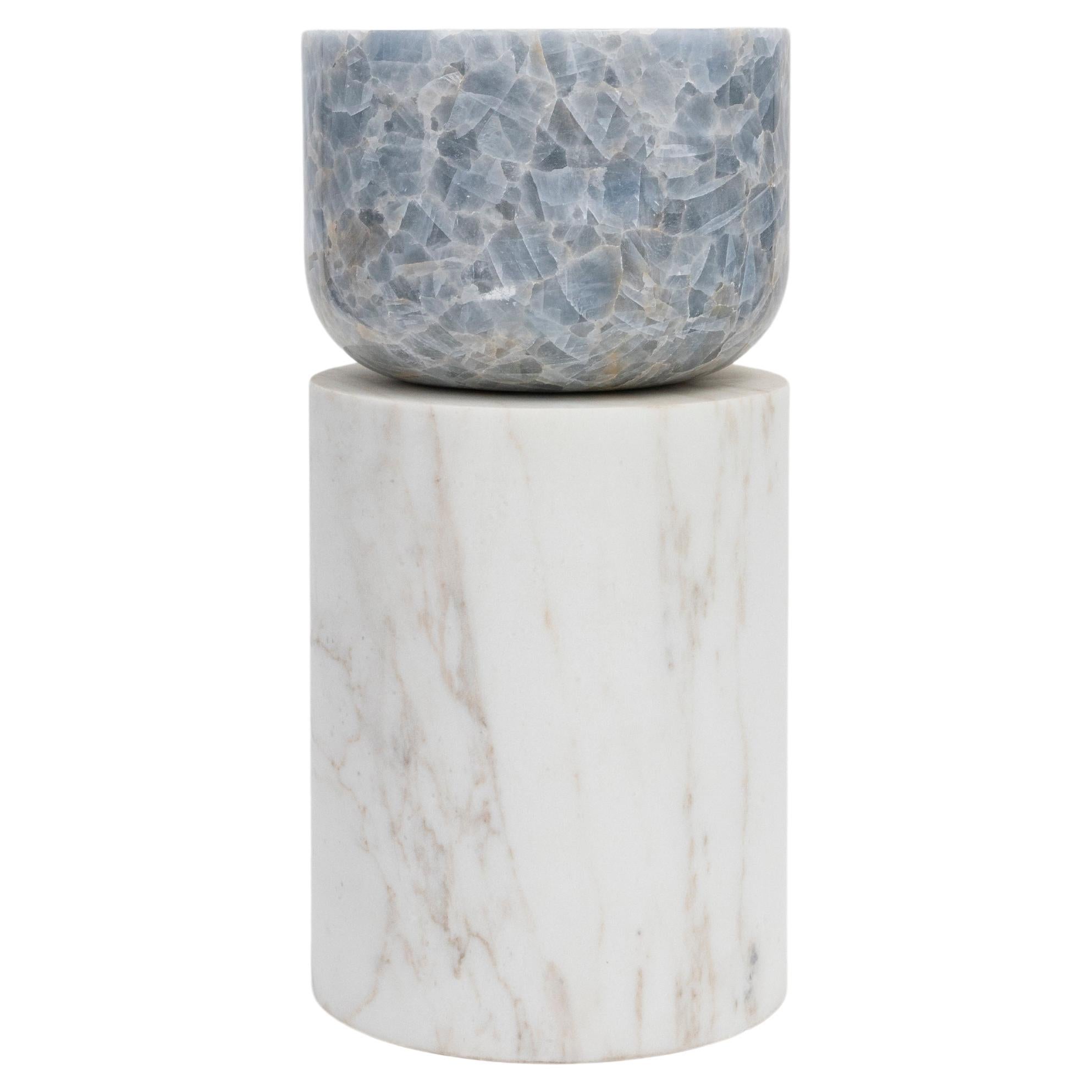 Materials: Golden Calacatta marble and blue calcite
Indoors and outdoors
Side table / Stool

While, in principle, marble bears not a volcanic origin, the veiny, fine-grained Yule marble employed for this variation of Sten Studio’s distinctive stools
