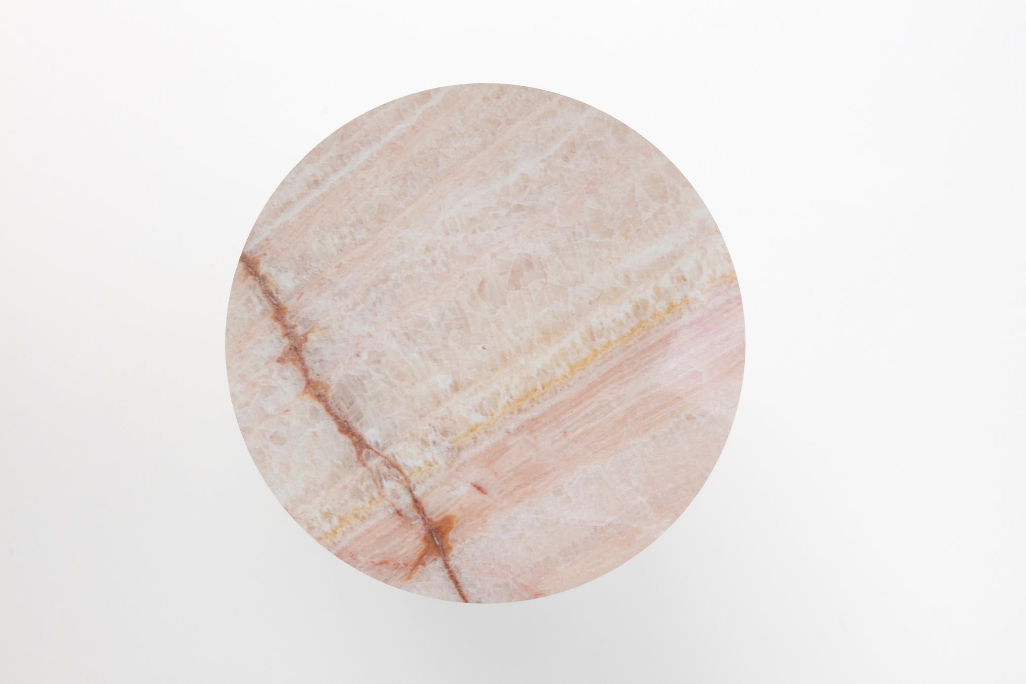 Materials: Golden Calacatta marble and pink onyx
Indoors and outdoors
Side table / Stool

While, in principle, marble bears not a volcanic origin, the veiny, fine-grained Yule marble employed for this variation of Sten Studio’s distinctive stools is