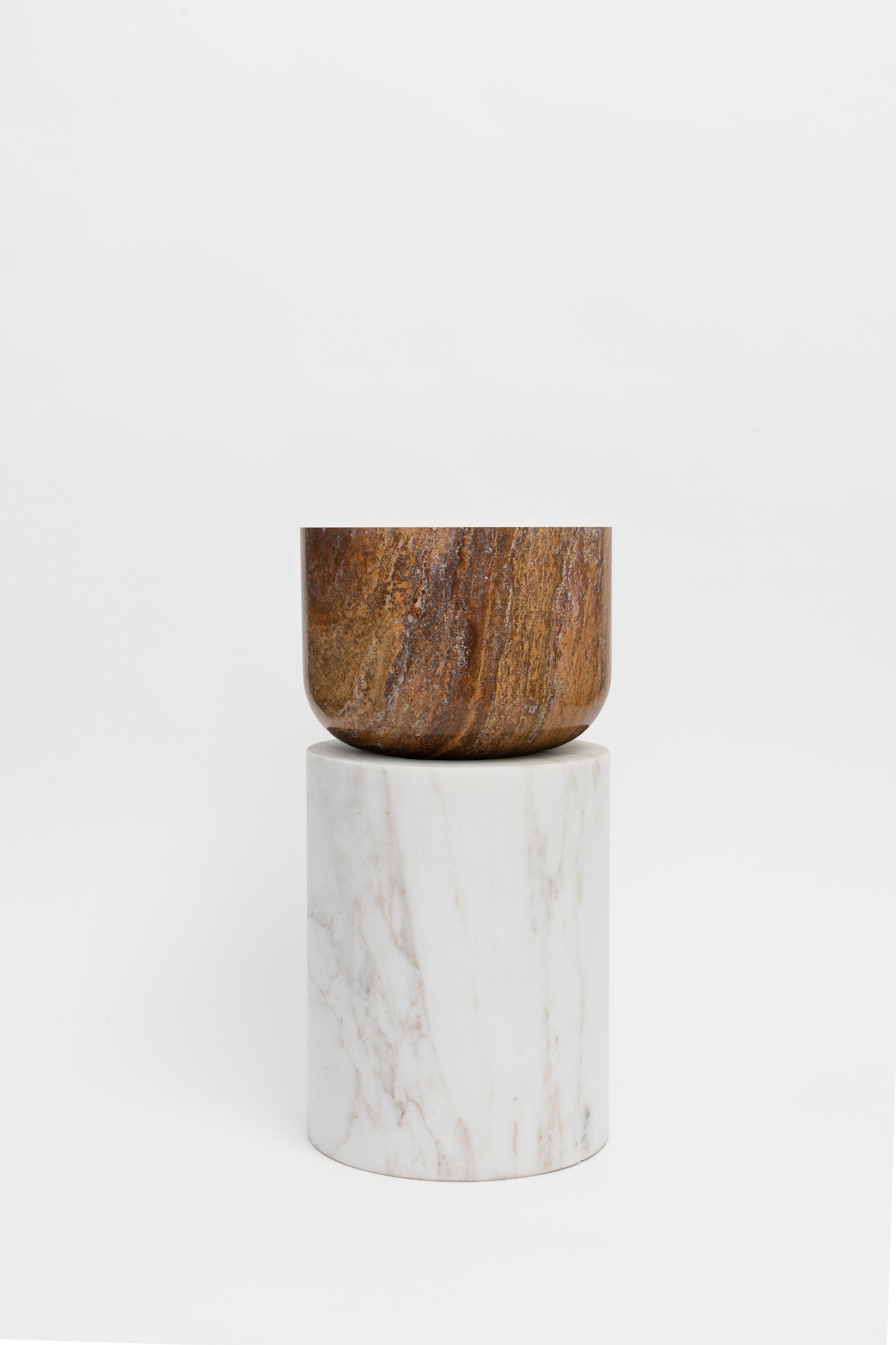 Materials: Golden Calacatta marble and red travertine
Indoors and outdoors
Side table / Stool

While, in principle, marble bears not a volcanic origin, the veiny, fine-grained Yule marble employed for this variation of Sten Studio’s distinctive