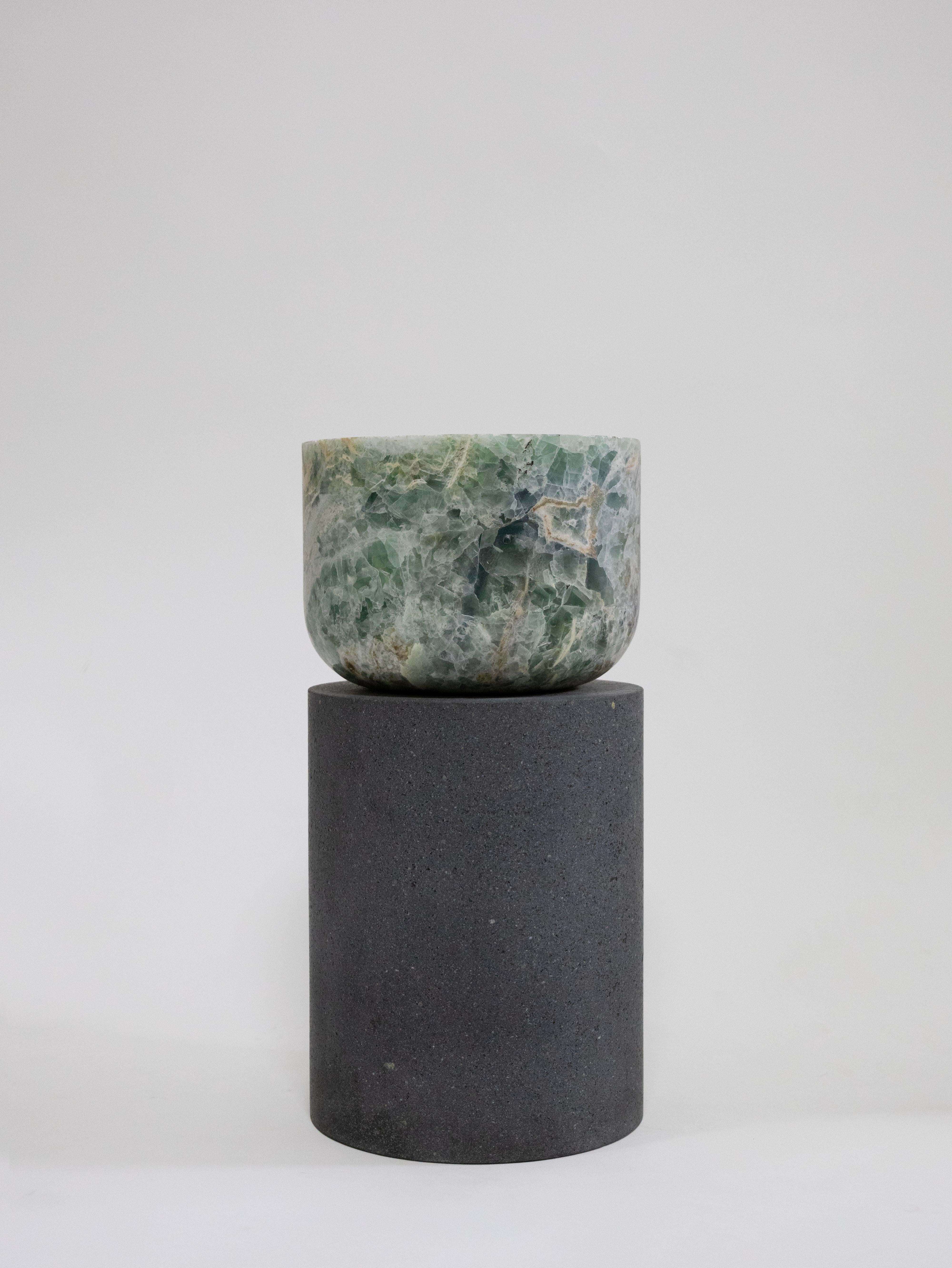 Materials: Lava stone and fluorite
Indoors
Side table / Stool

Through an abstract geometric language where cubes and cylinders playfully alternate, these stools represent the millenary connections existing inside the Earth; they are a visual