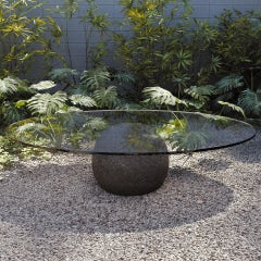 Volcanic stone and glass coffee table