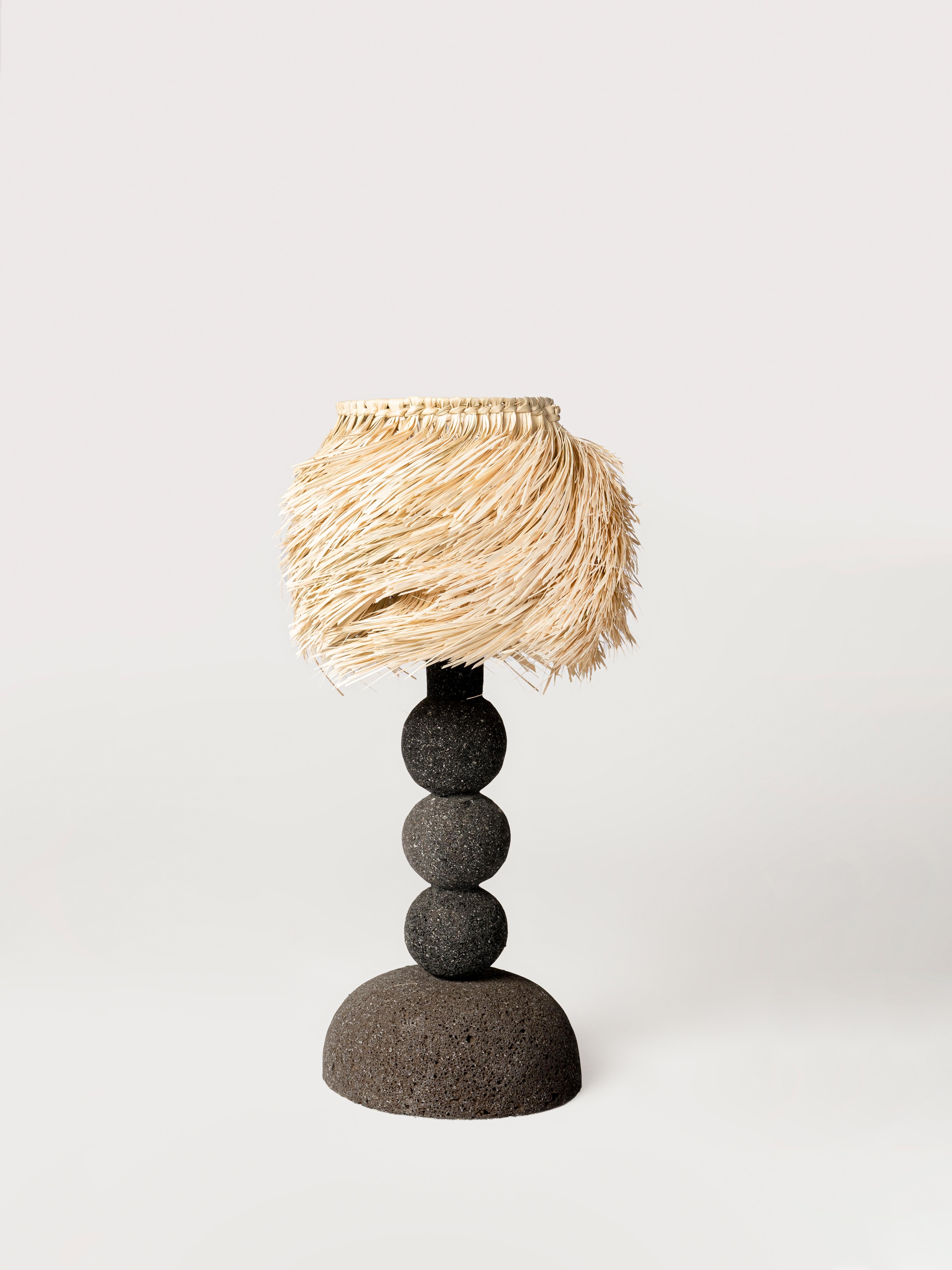 Volcanic Stone Spheres Desk Lamp with Palm Screen by Daniel Orozco.
Dimensions: D 30 x H 45 cm.
Materials: Volcanic stone, palm screen.

All our lamps can be wired according to each country. If sold to the USA it will be wired for the USA for