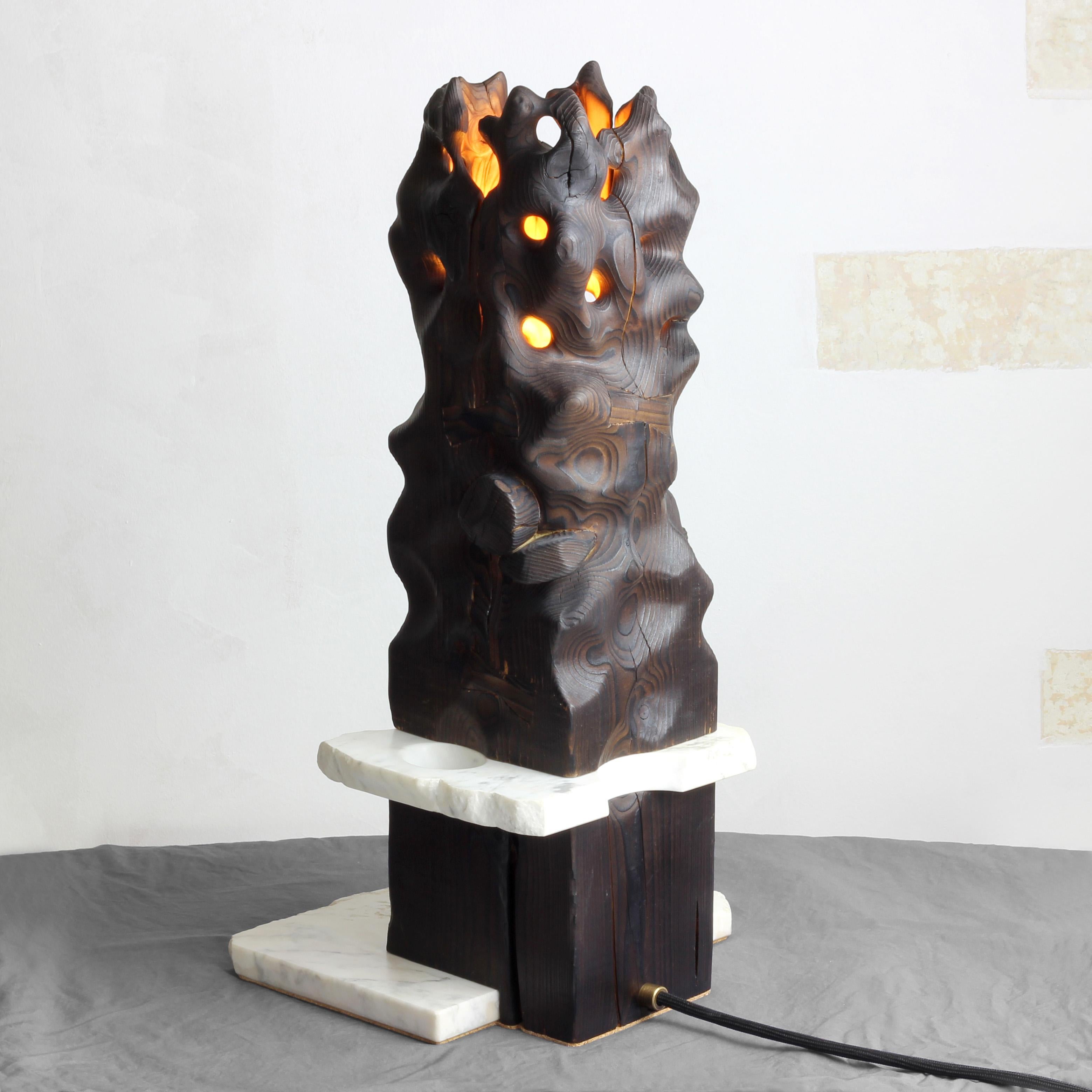 Volcano Table Lamp by Gabor Gobi
Unique Piece.
Dimensions: D 25 x W 23 x H 50 cm.
Materials: Pine wood and white marble.

This artfully sculptured light fixture is crafted from repurposed beam wood and remnants of white marble. Each piece is