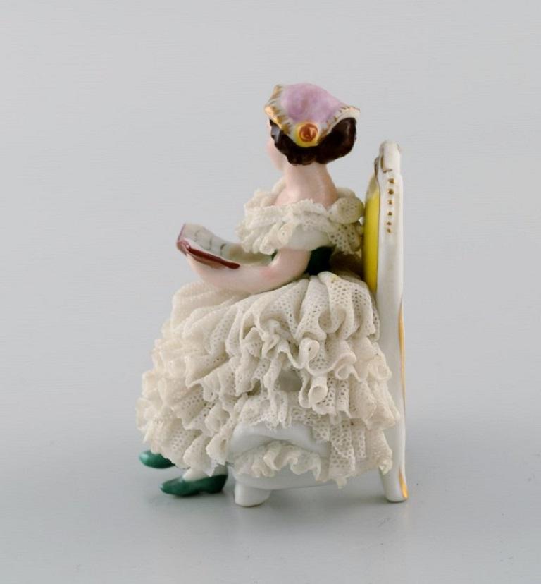 Hand-Painted Volkstedt Rudolstadt, Germany, Porcelain Figure, Reading Woman in a Skirt For Sale
