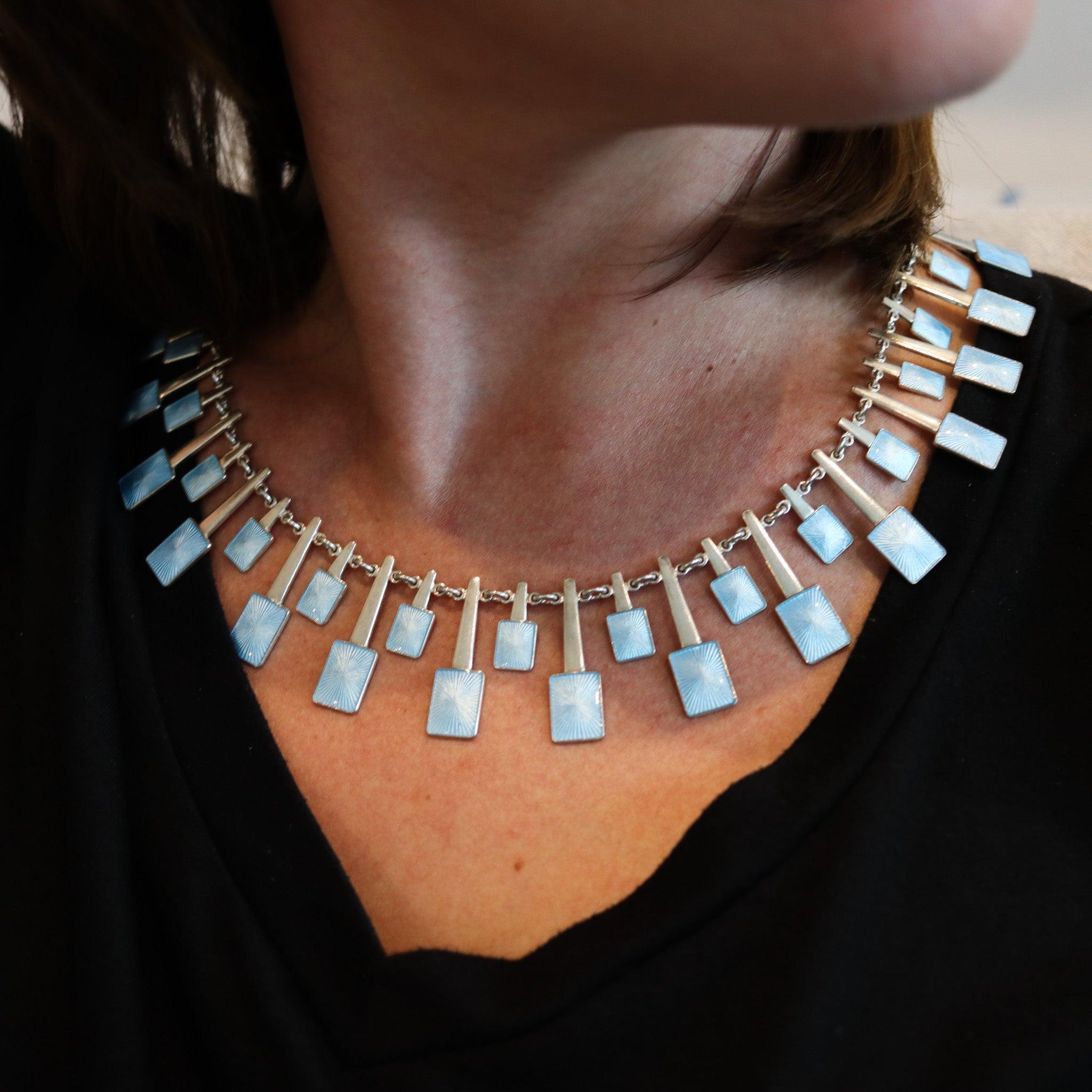 An enameled modernist necklace designed by Volmer Bahner (1912-1995).

This is a fabulous geometric necklace, created in Denmark by Volmer Bahner, back in the 1970. The necklace has been crafted with modernist patterns in solid .925/.999 sterling