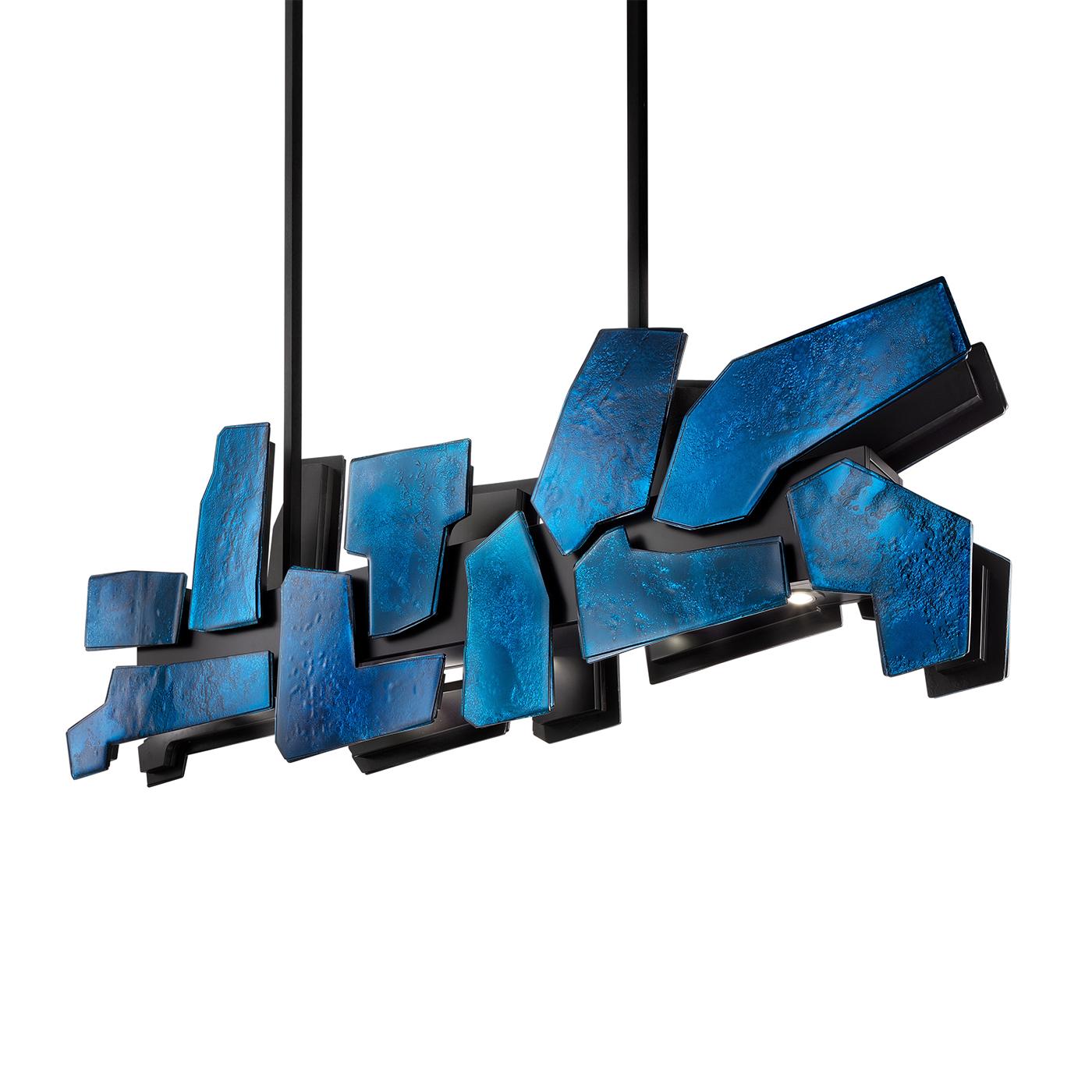 This chandelier features two layers of irregular-edged baked glass plates, varnished in blue with a medium antique finish for a silvered effect. Supported by a matte black lacquered wood and metal structure, it boasts 11 strategically placed LED