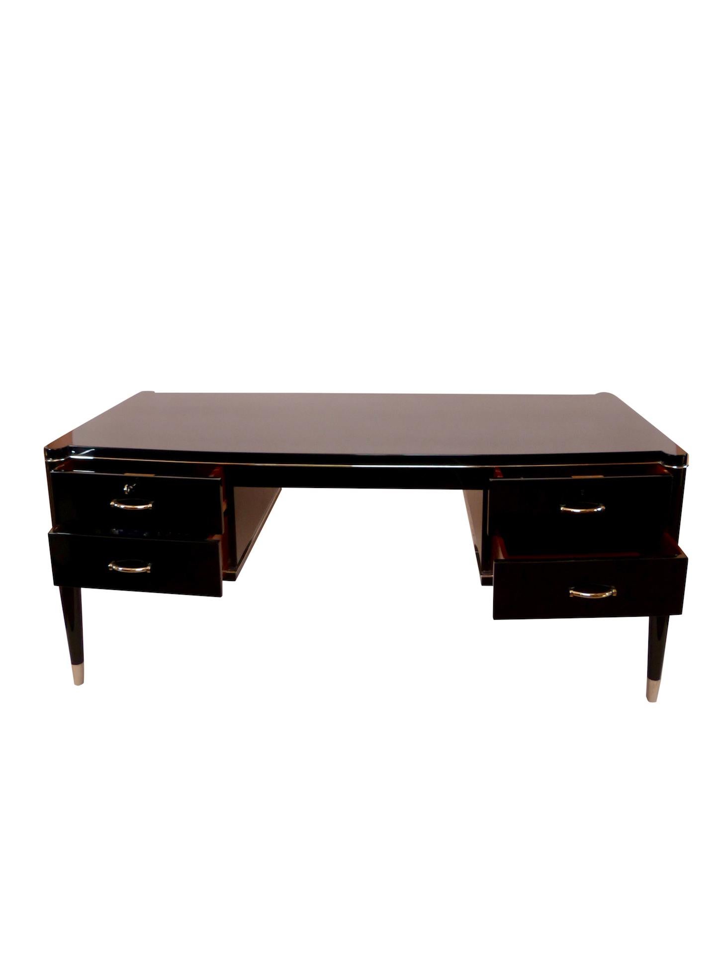 Representative desk for the Bosses in the executive suite 
Two doors on the backside for the secretary 
High gloss black piano lacquer
Nickeled metal fittings and sabots
All metals original
Four drawers, two with key lock 
Original Belgian Art