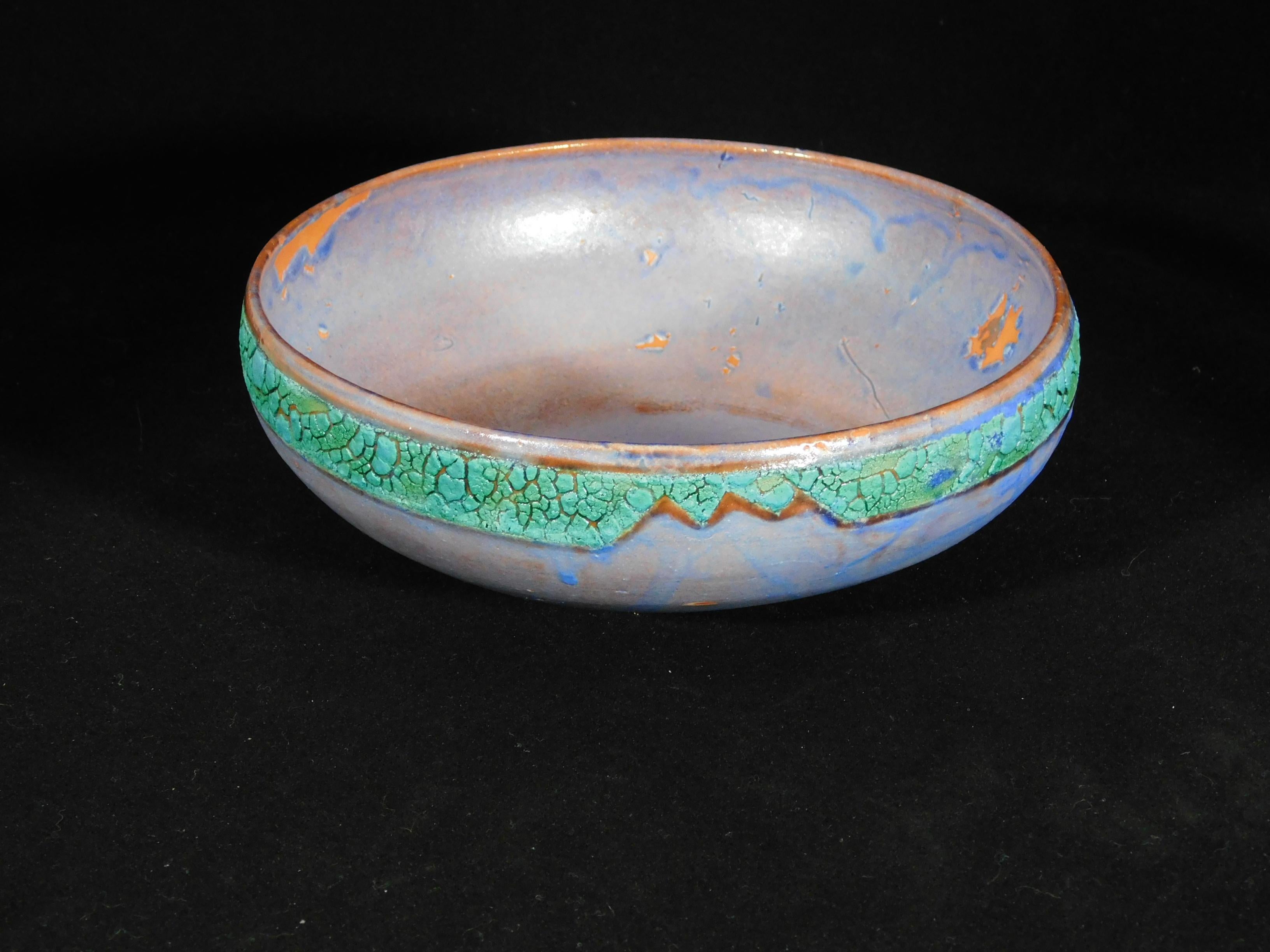 Voltaire wheel thrown earthenware bowl by ceramicist Andrew Wilder.
This is a one of a kind object made in the ancient way- by hand in a small artisanal pottery. In this series Wilder explores the application of lichen under glazes to achieve