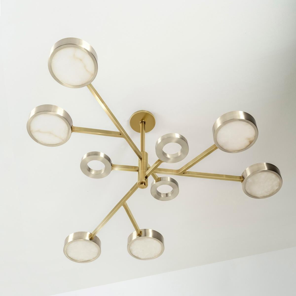 The Volterra ceiling light is an ode to the historic Tuscan city by the same name known for its striking architecture and its precious stone quarries. The fixture exemplifies these qualities with its sculptural counter-balance design, cast brass