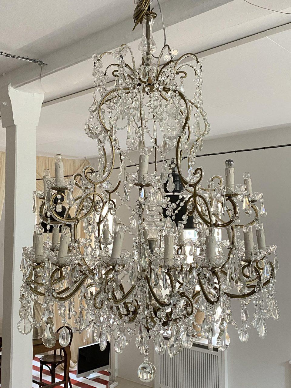 Sumptuously beautiful and voluminous cage-shaped prism chandelier, from circa 1920s-30s France. Of a kind one only really sees in French chateaus and mansions or grand hotels. The chandelier has an abundance of clear prism anchors and beautiful