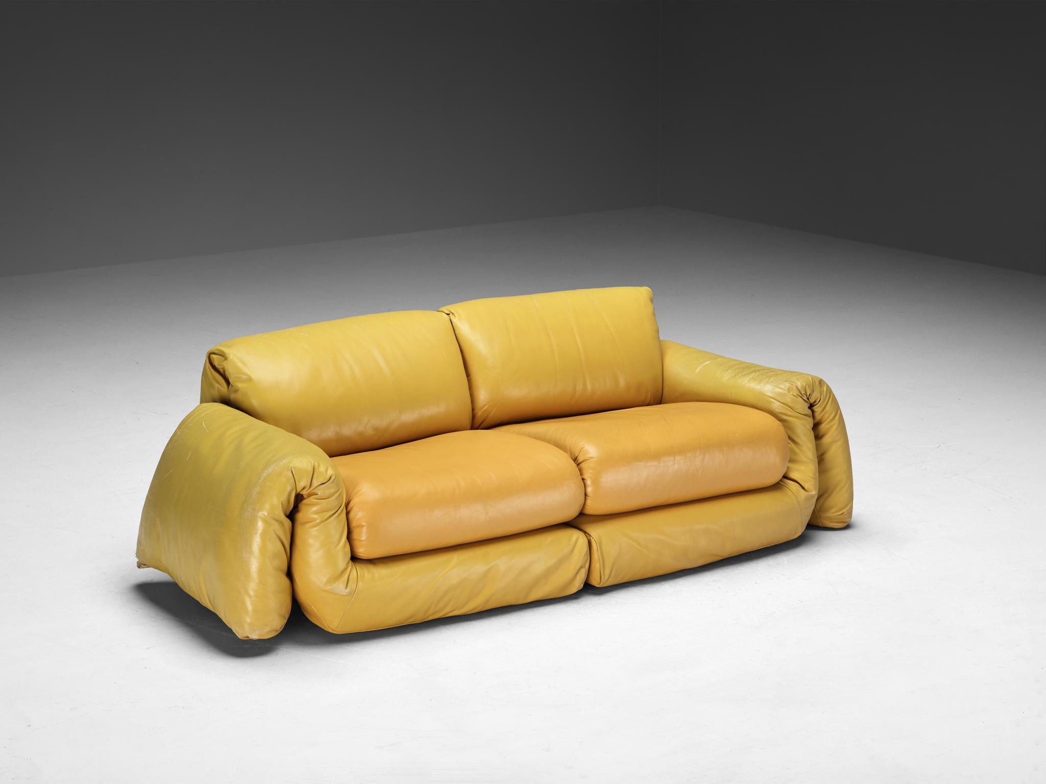 Sofa, leather, Europe, 1970s

Eye catching sofa made in the vibrant 1970s in Europe. This piece serves as a embodiment of both stylish design and comfort, with its plush and very soft leather cushions. This piece boasts a vibrant yellow leather