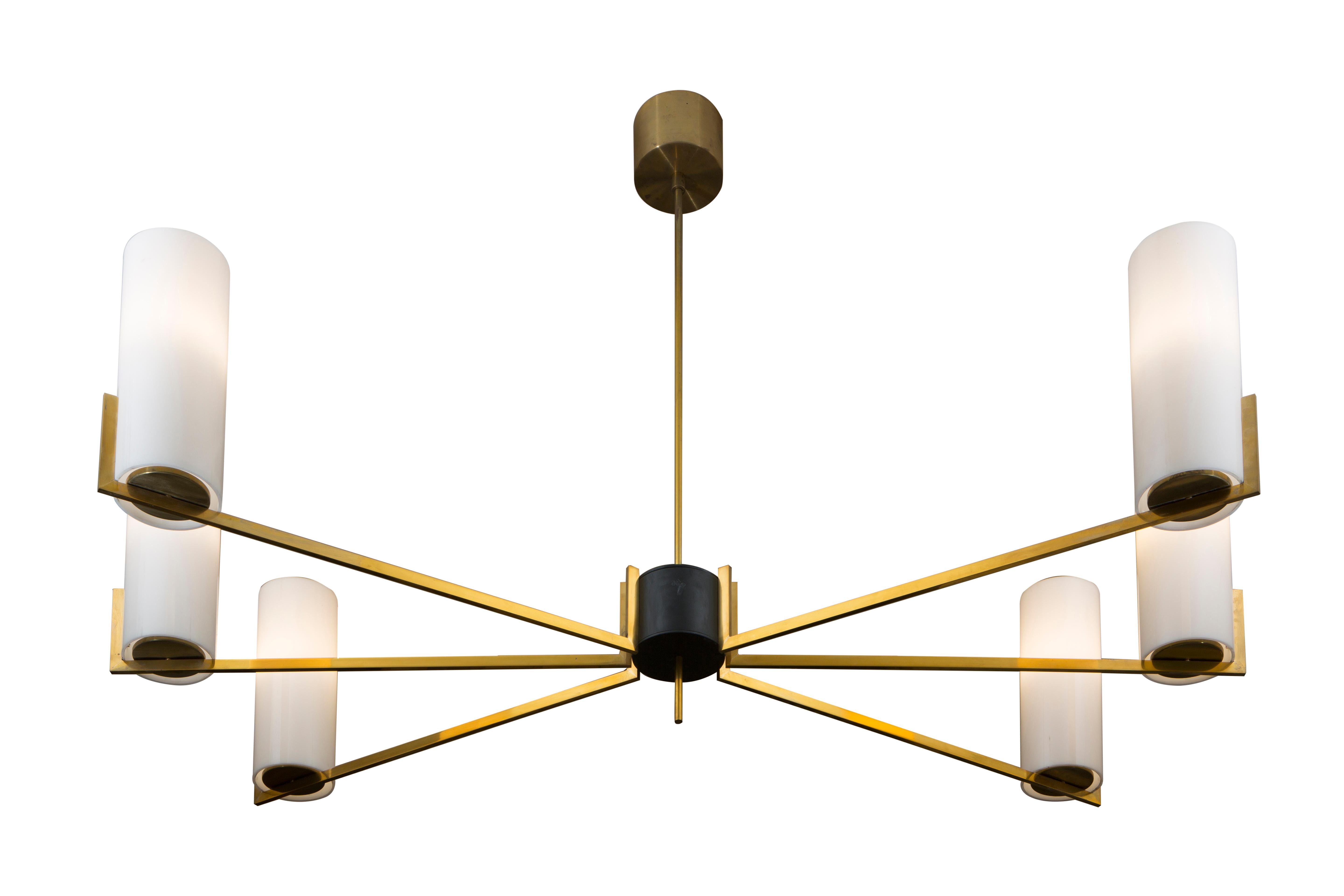This exquisite piece, inspired by the landscape of Los Angeles in the 30s with its elegant Cafe Society atmosphere, will bring a touch of modern sophistication to any home. The brass structure is comprised by a center shaft from which six brass arms