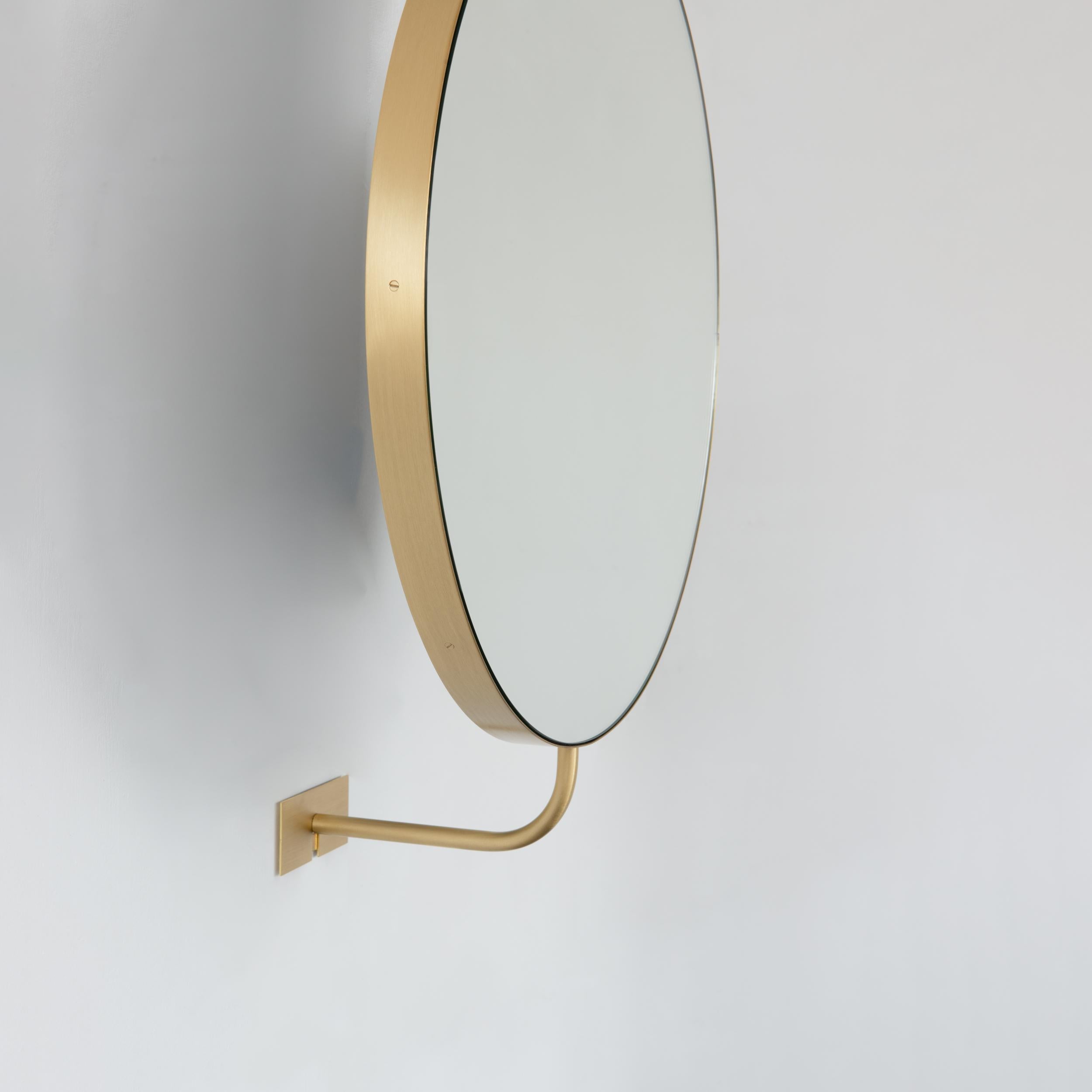 Contemporary Vorso Wall Attached Suspended Rotating Round Mirror with Brushed Brass Frame For Sale