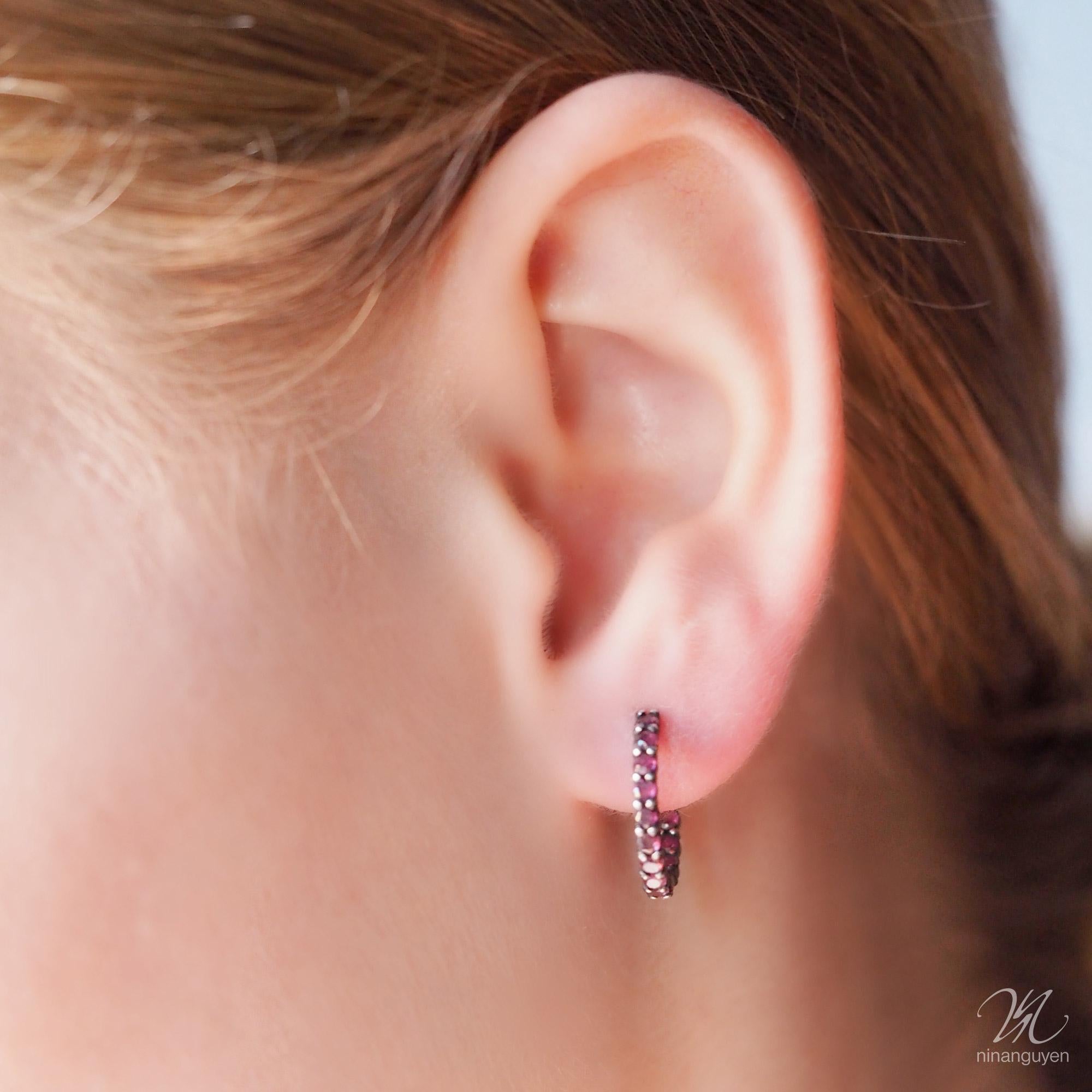 Going spiral: Rubies adorn the inside and outside curves of our Vortex 18mm Gold & Oxidized Hoops, while subtle grooves in the metalwork add a cool graphic edge to the design. 

Stone carat: 1.0
Size: 18mm
