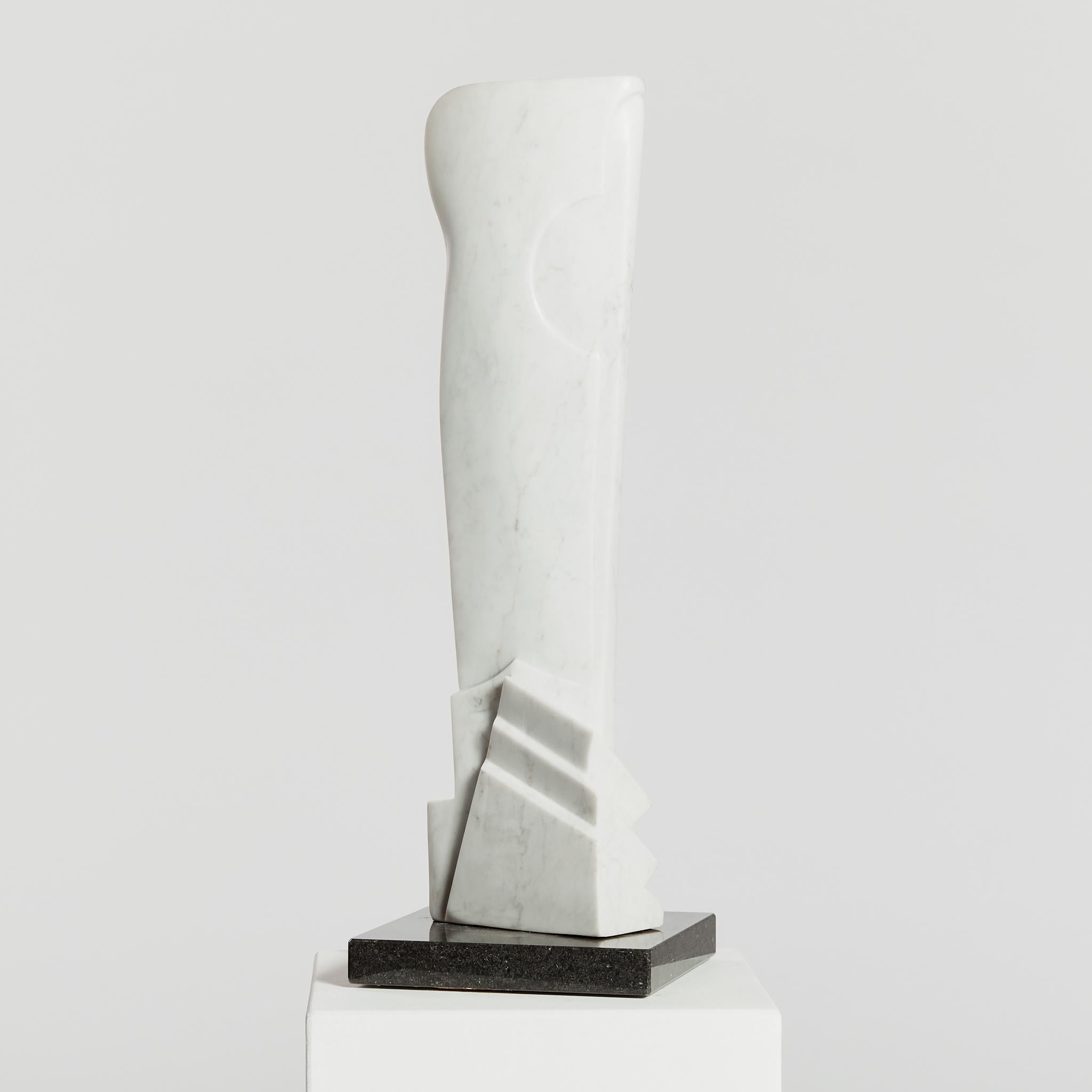 Over half a metre tall and in the style of vorticism, this abstract sculpture is hand carved from Carrara marble, mounted on a contrasting granite base. 
The vorticists were a British avant-garde group formed in London in 1914 with the aim of