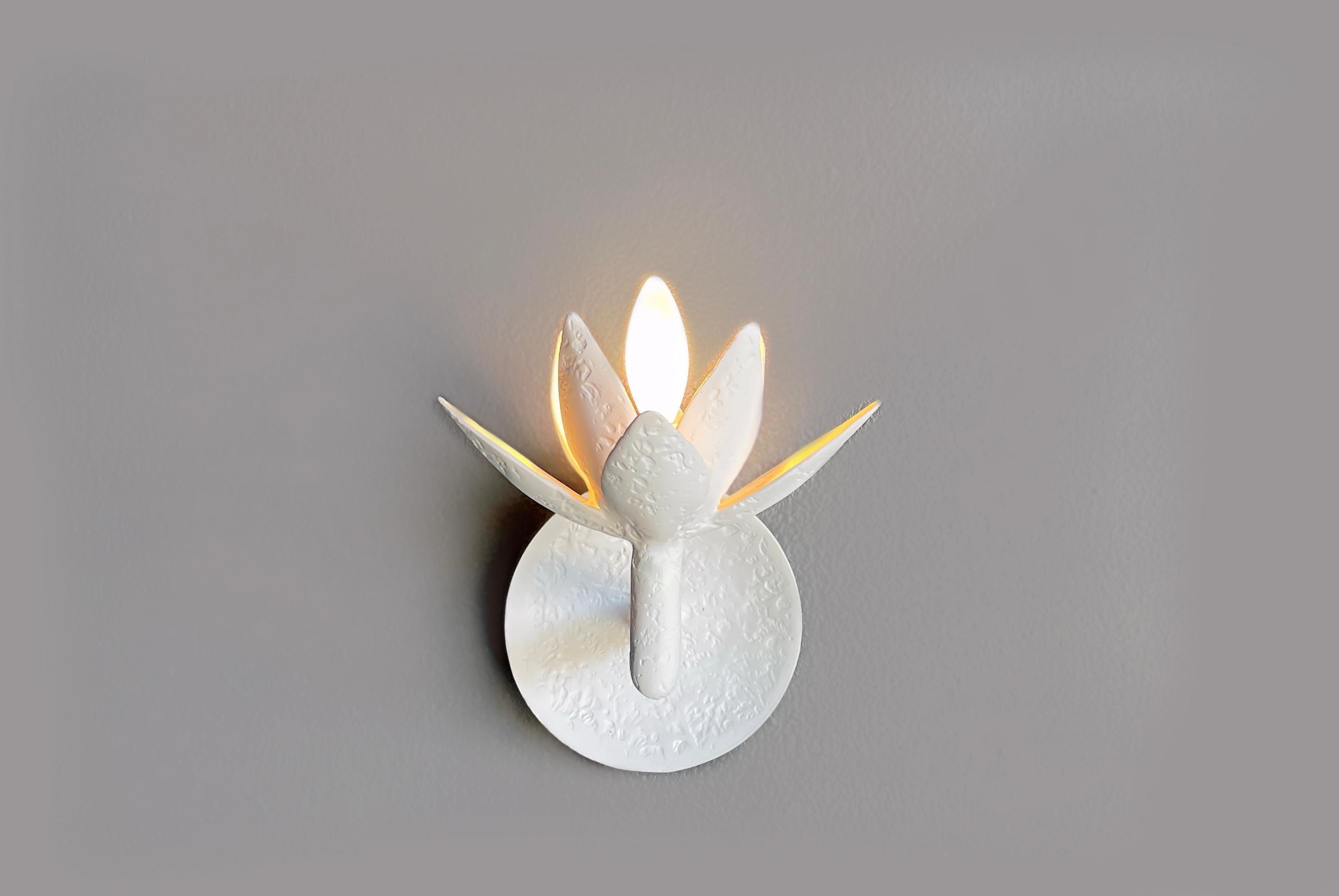 This sconce has our signature plaster of Paris finish and it was designed to complement our Vosges Chandelier. The versatile sconce will accentuate the beauty of your home with an understated complexity. The candelabra based bulb (60 watts Max) in