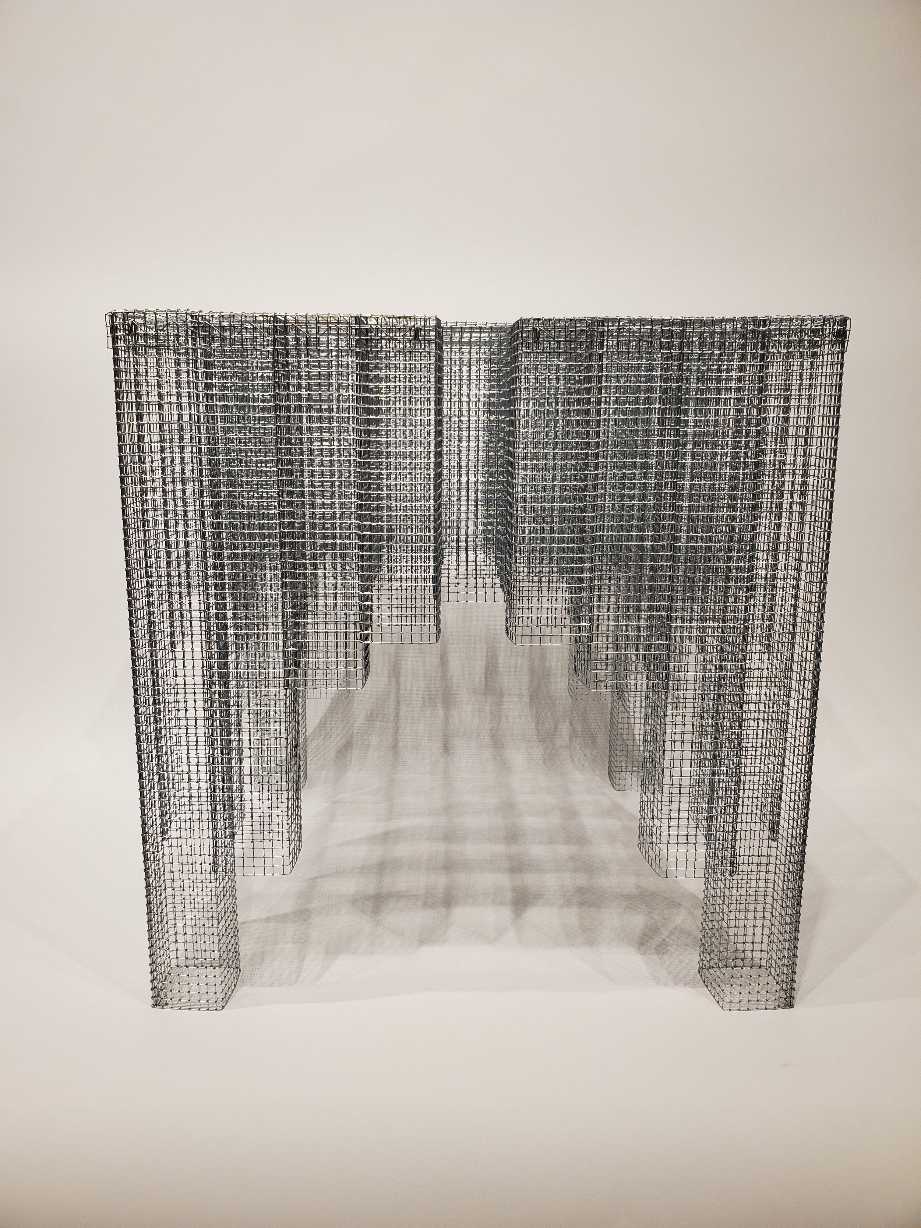 Voukenas Petrides
Blur table
Zinc-coated wire mesh,
2019

Voukenas Petrides is a design studio based in New York and Athens. Furniture designer Andreas Voukenas and architect Steven Petrides combine their talents to produce poetic furniture