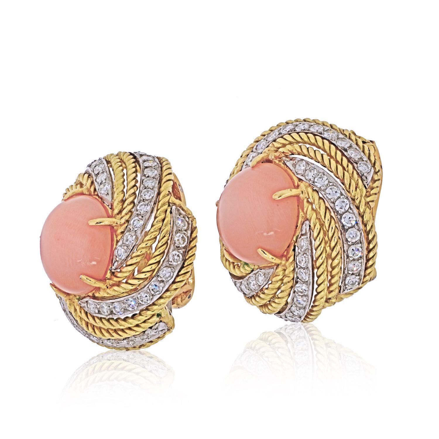Pair of 18k gold cocktail earrings by Vourakis, with 12mm corals, surrounded with approx. 1.50ctw in diamonds. Earrings are 25mm in diameter. Marked: Vourakis, 750, F73. Weight - 22.8 grams.
Clip on 
