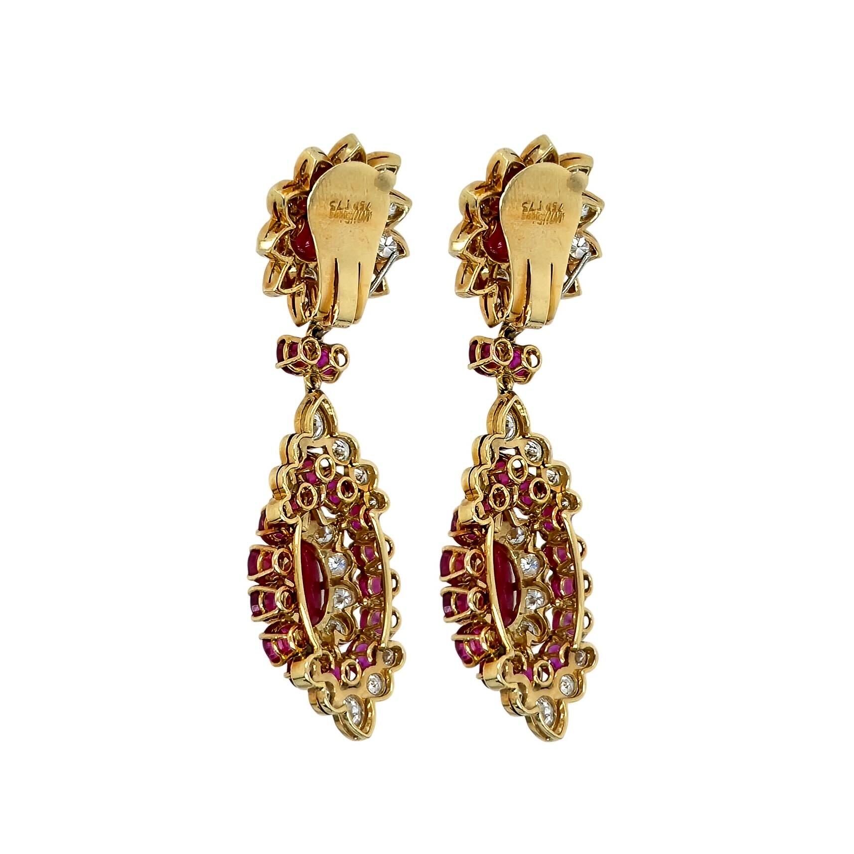 A pair of 18 karat yellow gold, ruby and diamond earrings.  Vourakis.  The earrings are set with four cabochon oval rubies totaling approximately 14.50 carats, 32 round rubies totaling approximately 8.00 carats, and 90 round diamonds totaling