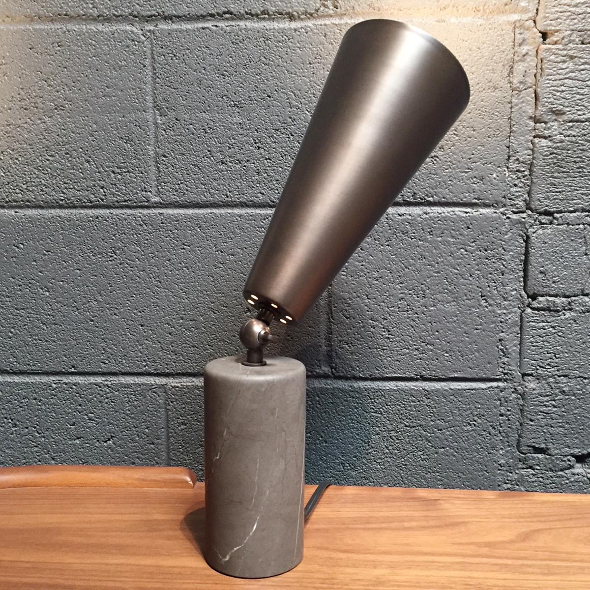 US 110v table lamp with Persian grey stone base, dark bronze metal parts and adjustable diffuser, available from showroom display. 
Measure: 5
