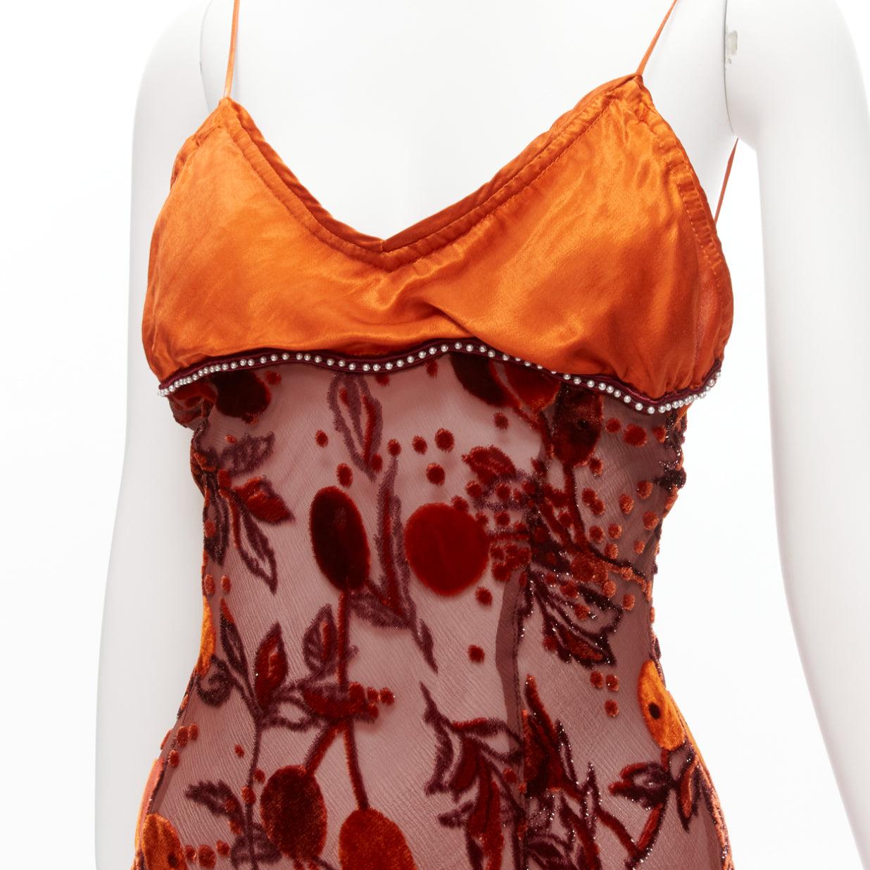 VOYAGE INVEST IN THE ORIGINAL LONDON orange satin brown velvet embroidery bias cut sheer midi slip dress
Reference: GIYG/A00357
Brand: Invest in the original voyage
Material: Rayon, Silk
Color: Orange, Multicolour
Pattern: Floral
Closure: