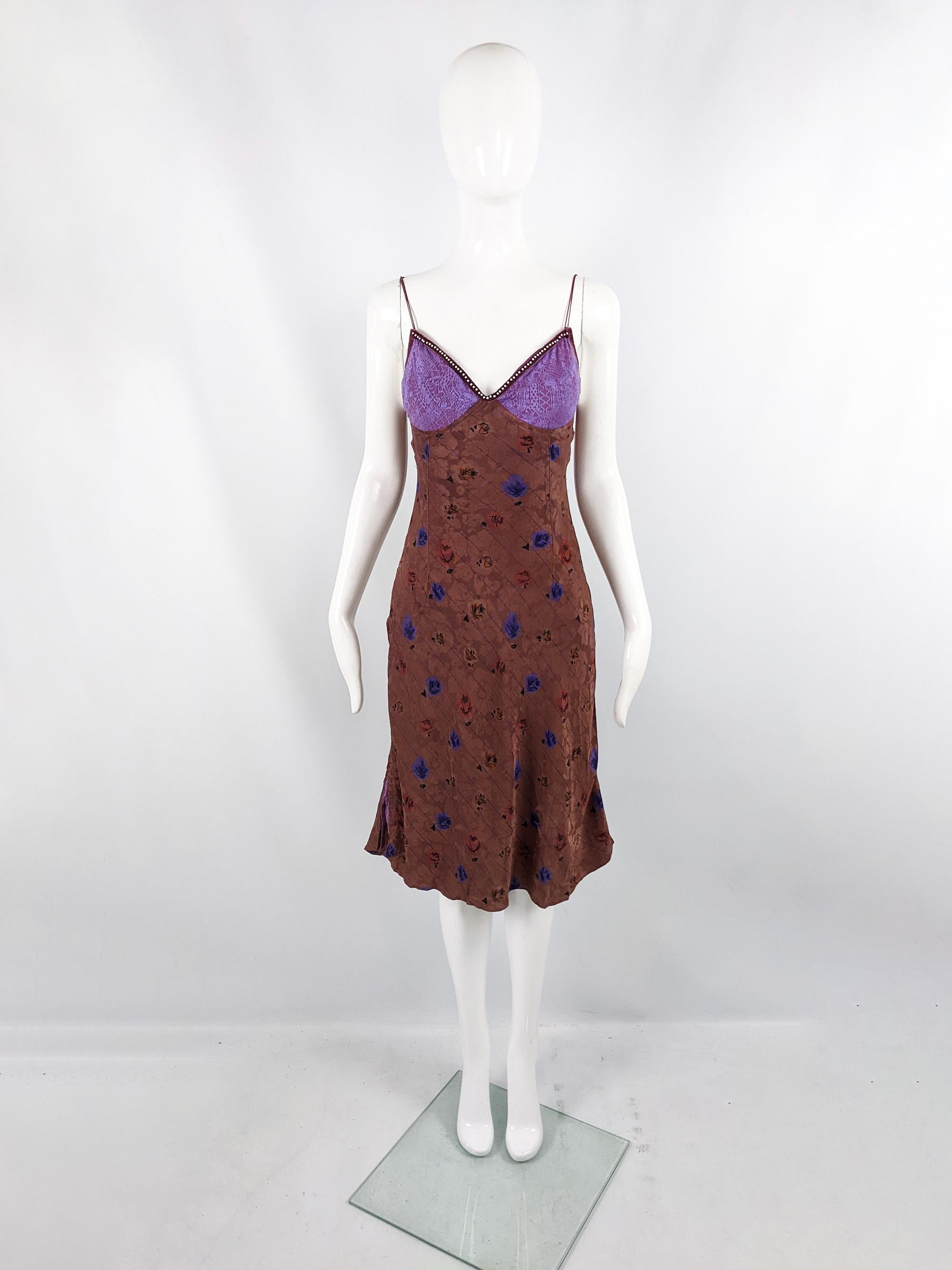 An incredible vintage dress from the 90s by iconic British label, Voyage (infamous for their unique designs in the 90s and banning the likes of Madonna & Naomi Campbell) for their mainline label. In a brown silk fabric with a cute floral pattern