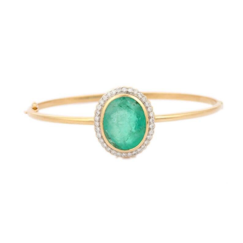 Halo Diamond and Emerald Bangle Bracelet in 18K gold. It’s a great jewelry ornament to wear on occasions and at the same time works as a wonderful gift for your loved ones. 
Emerald enhances the intellectual capacity.
These lovely statement pieces