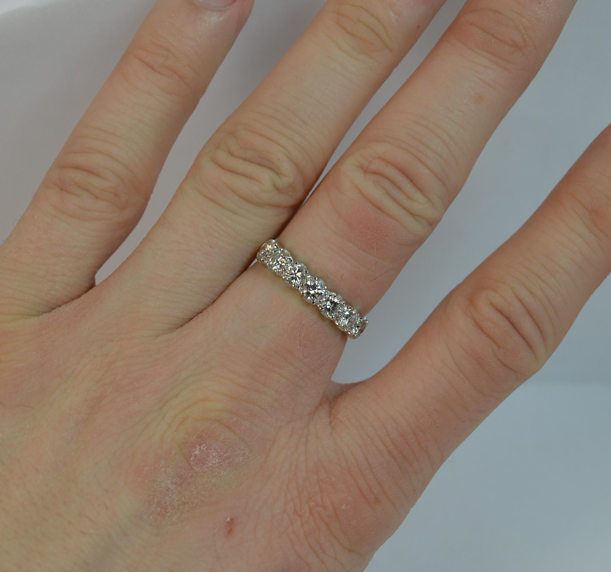 A stunning ladies diamond half eternity stack ring.
SIZE ; N 1/2 UK, 7 US
Solid 18 carat yellow gold shank and white gold head setting.

Set with seven round brilliant cut diamonds. 0.75cts in total. Very clean, bright and sparkly diamonds. Vs