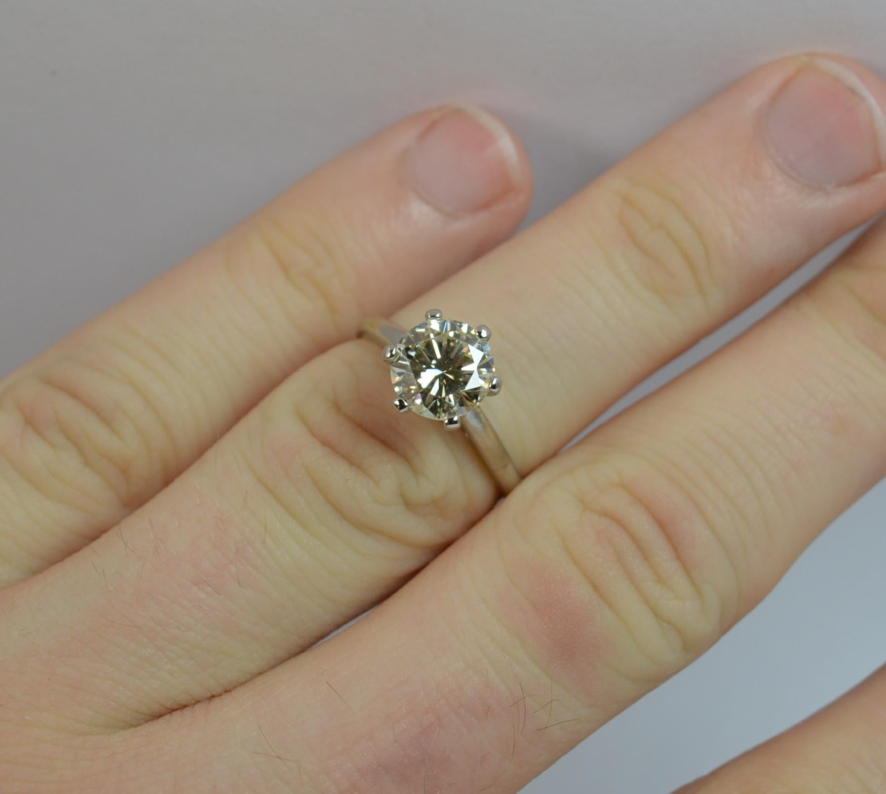 
A stunning 18ct gold and diamond solitaire ring.

A solid 18 carat white gold example.

​Set with a natural round brilliant cut diamond to the centre, 7.2mm diameter in a six claw mount. Protrudes 7.5mm off the finger. Weighs approx 1.40 carats, VS