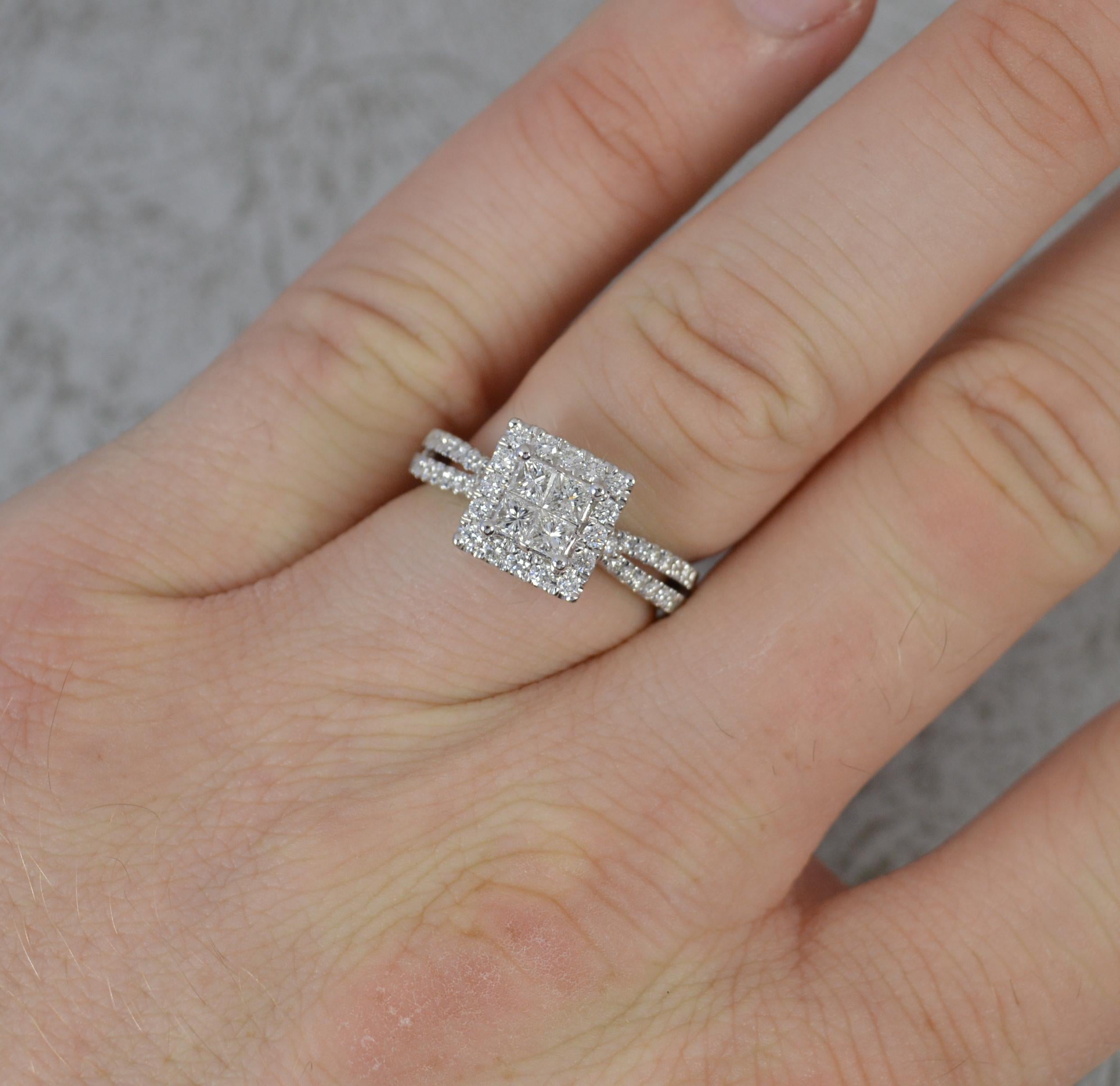 A superb diamond ring.
Solid 950 grade platinum shank.
Set with four princess cut diamonds to the centre with a full border of smaller round cut diamonds and additional diamonds to the shoulders. Vs clarity, f-g colour.
8.9mm x 9.1mm cluster