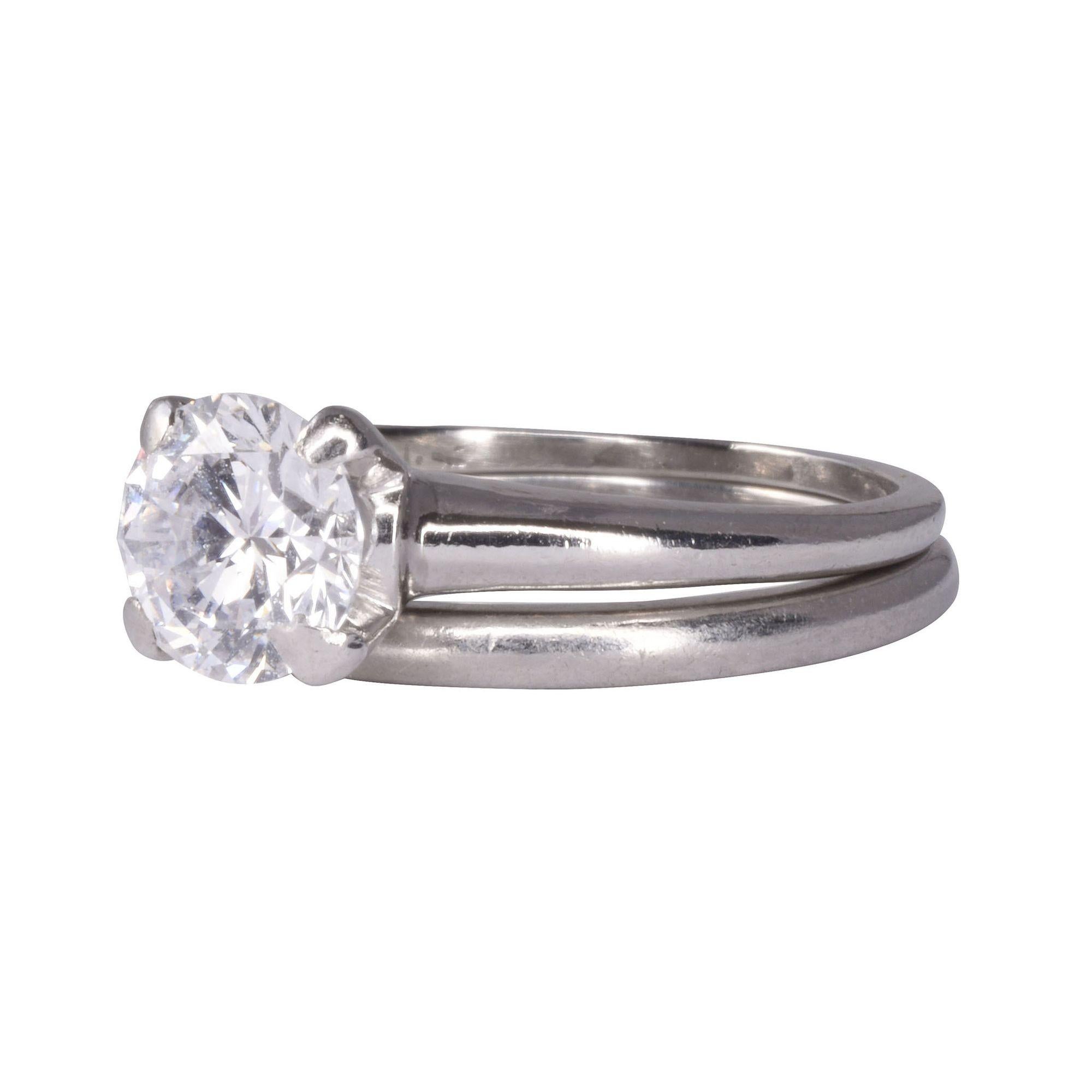 Estate VS diamond solitaire platinum wedding set. This platinum wedding set features a solitaire diamond engagement ring. The diamond is a .80 carat with VS clarity and H color. This solitaire diamond wedding set is a size 4.75. [KIMH 2101 P]