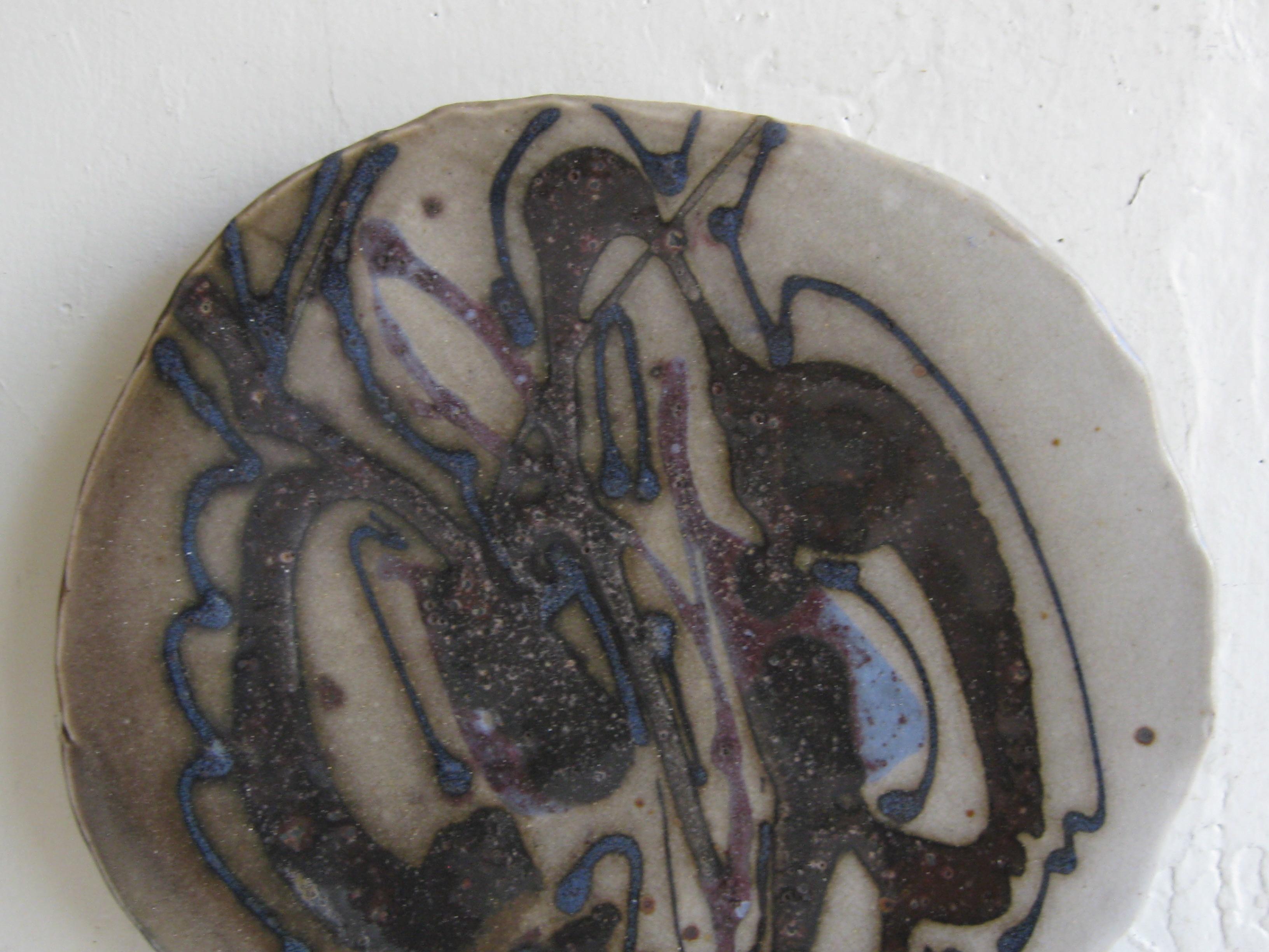 Very hard to find Janet Rothwoman California studio art pottery plate/plaque dating from the 1960's. Janet was the wife of Jerry Rothman. This plate is a slab construction and has a wonderful abstract design and form. Signed with the makers hallmark