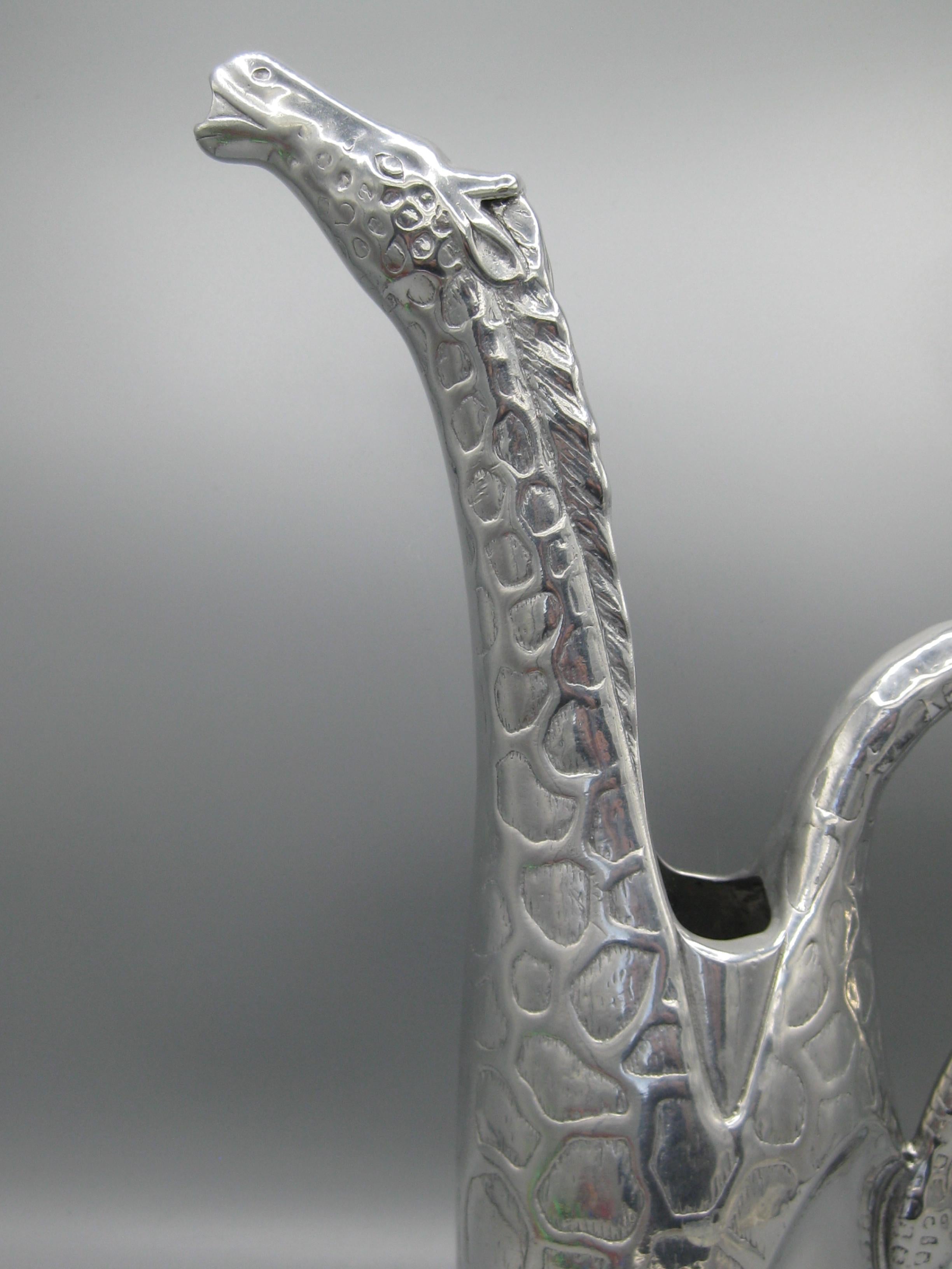 Wonderful modernist cast aluminum Arthur Court giraffe water pitcher. Made in 1989.. Still has the original price tag on the bottom and appears it has never been used, only displayed. Marked on the bottom as seen in the photos. In excellent