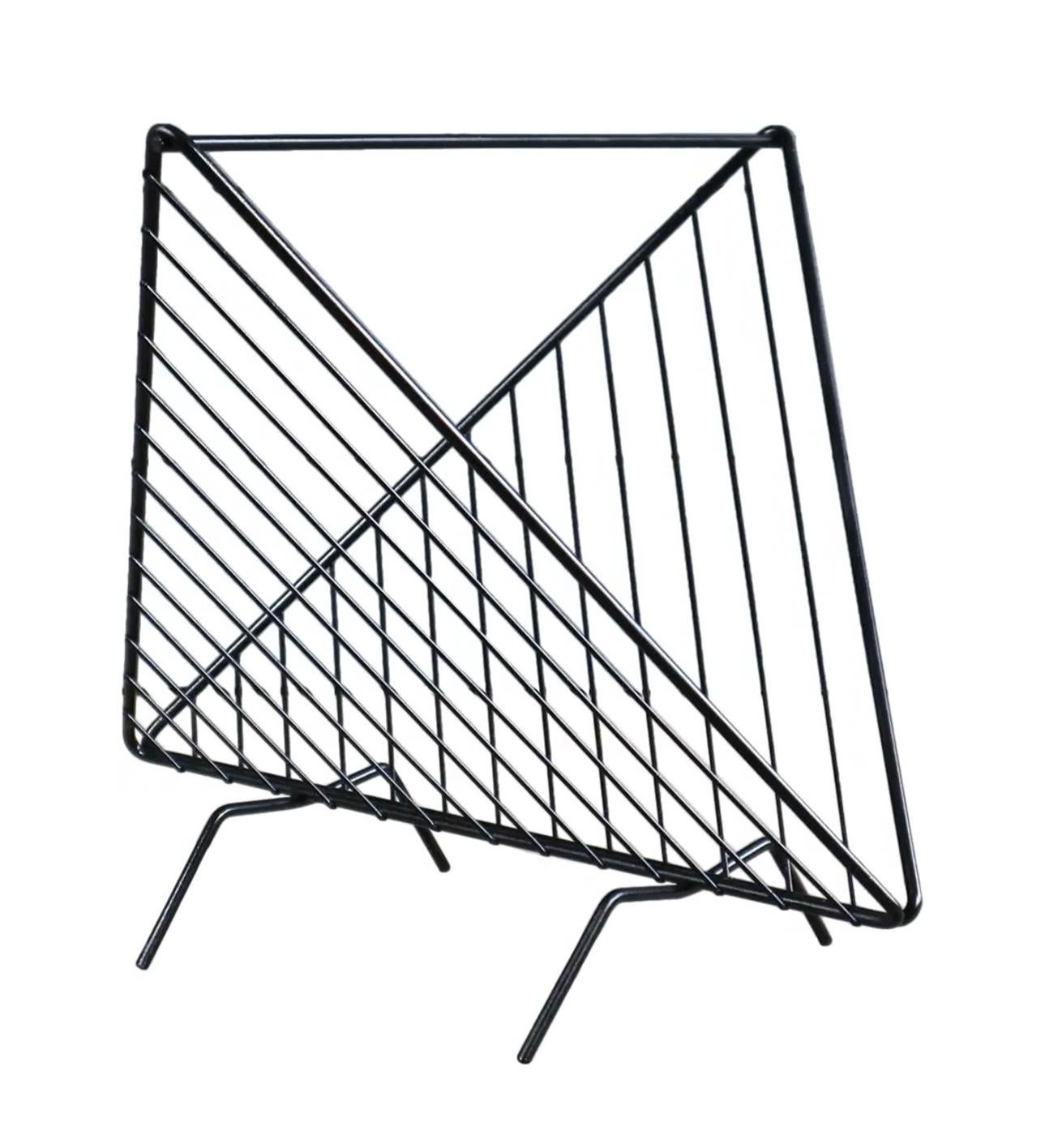 Elegant simplicity. 

Vintage Abstract Mathieu Matégot insp Mid Century Magazine Vinyl Album Holder Rack

Mathieu Matégot Inspired, Vintage, Geometric, Abstract, Black coated, Wire, Magazine or Vinyl Album Holder   Made in Italy 

Geometric Wire