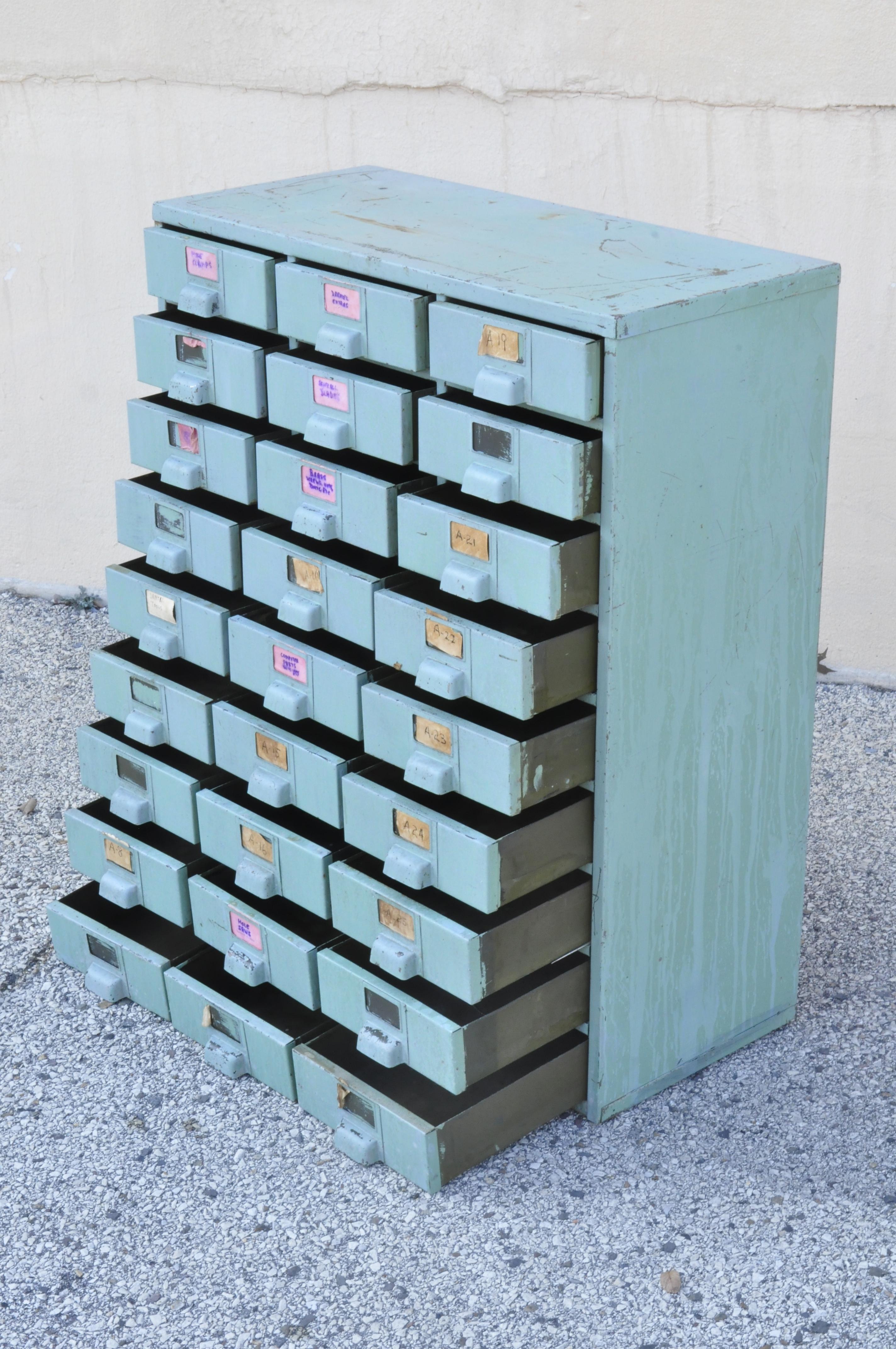 Vintage American Industrial green steel metal 27 drawer machinist tool chest cabinet. Item features (27) drawers, steel metal frame, green distress painted finish, quality American craftsmanship. Measurements: 37