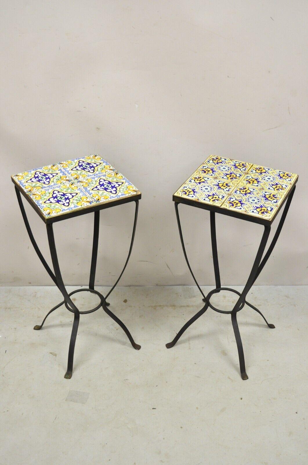 Vintage Arts & Crafts Style Yellow Blue Tile Top Iron Plant Stand Side Table - Pair. Item features a wrought iron base, mosaic tile tops, very nice vintage pair, great style and form. Circa Late 20th Century. Measurements: 26