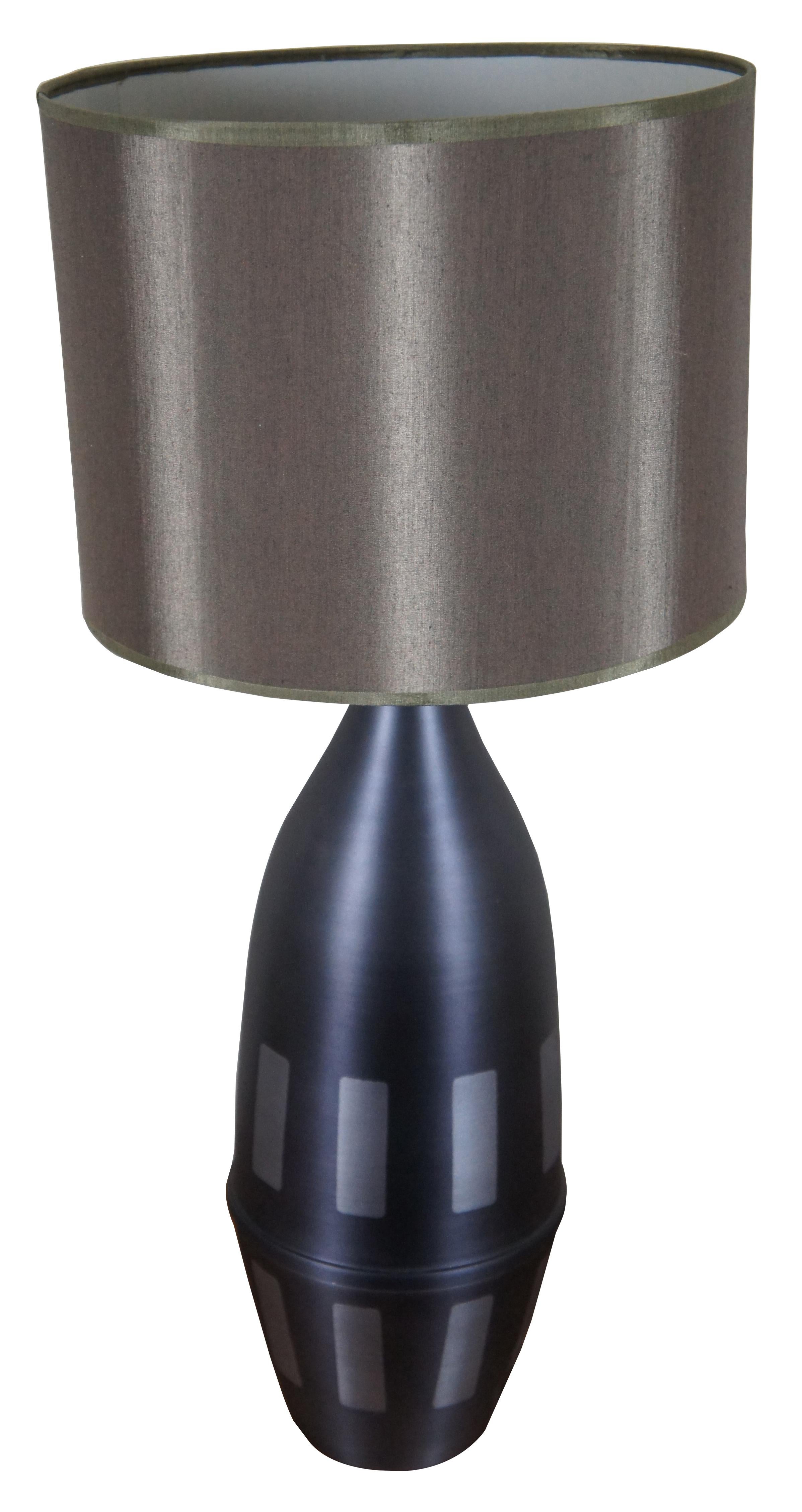 Vintage Babette Holland spun metal Juggler table lamp in graphite gray with geometric accents and an olive brown shade. The Juggler table lamp gets its name from its shape, which is similar to the pins juggled by a jester or clown. Style