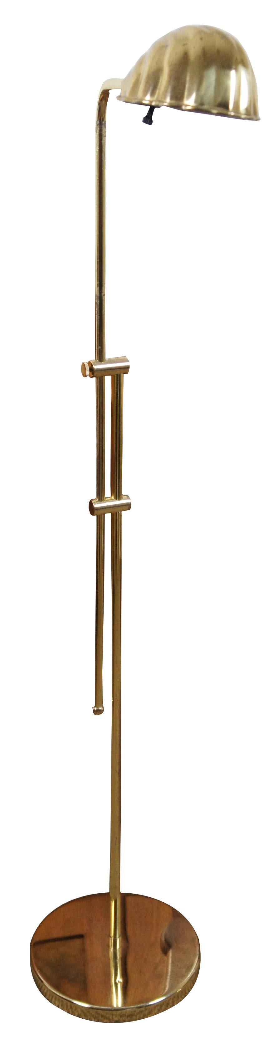 Mid-Century Modern vintage brass floor lamp with adjustable height and clam shell shaped shade.

Measures: 10” x 14” x 61” to 39.5” (width x depth x height).