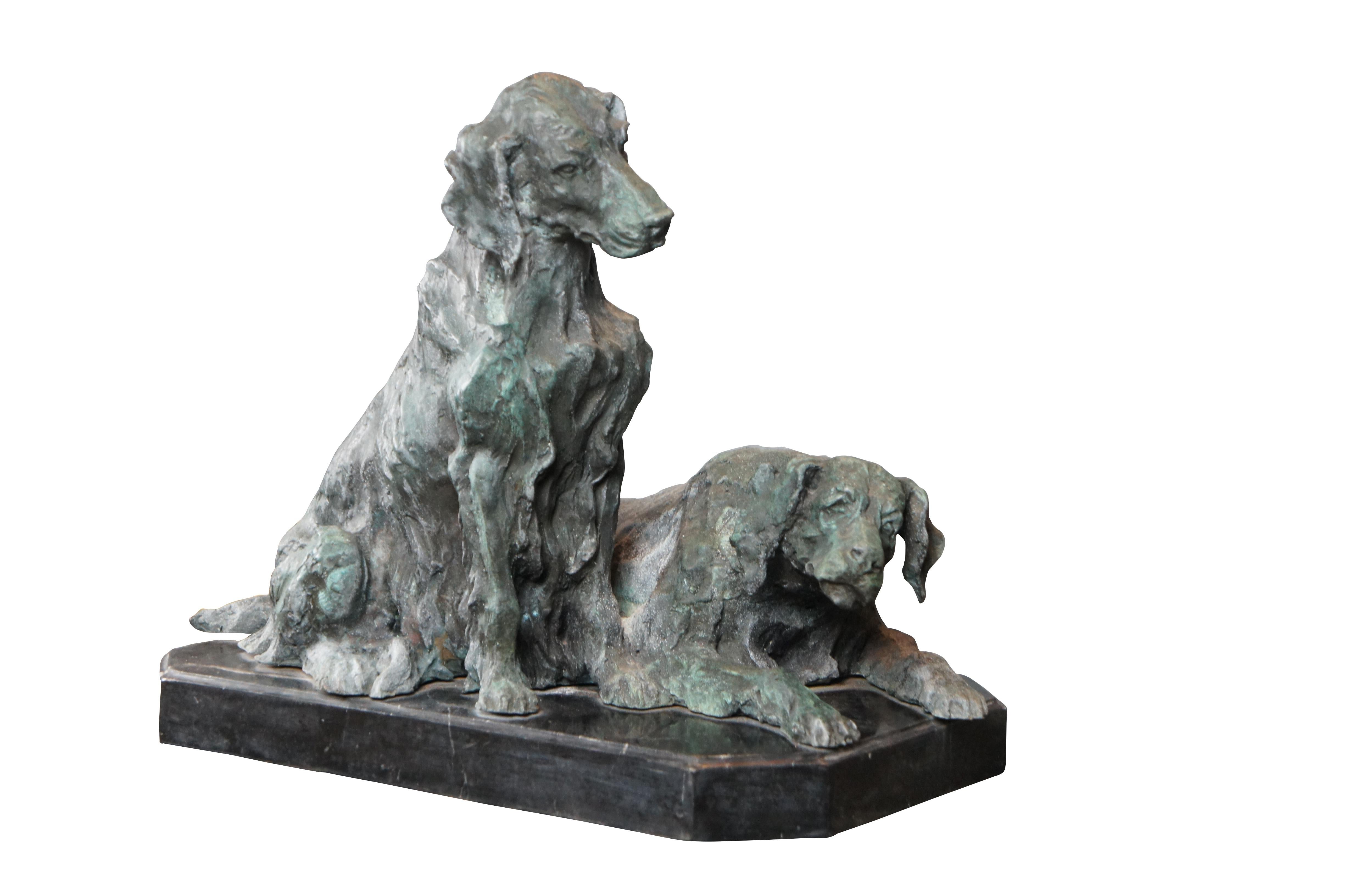 Late 20th Century bronze sculpture featuring two retrievers hunting dogs, one resting and the other kneeling. The bronze is done in French manner After Pierre Jules Mene Statue. Features a verdigris patina and rests upon a marble plinth