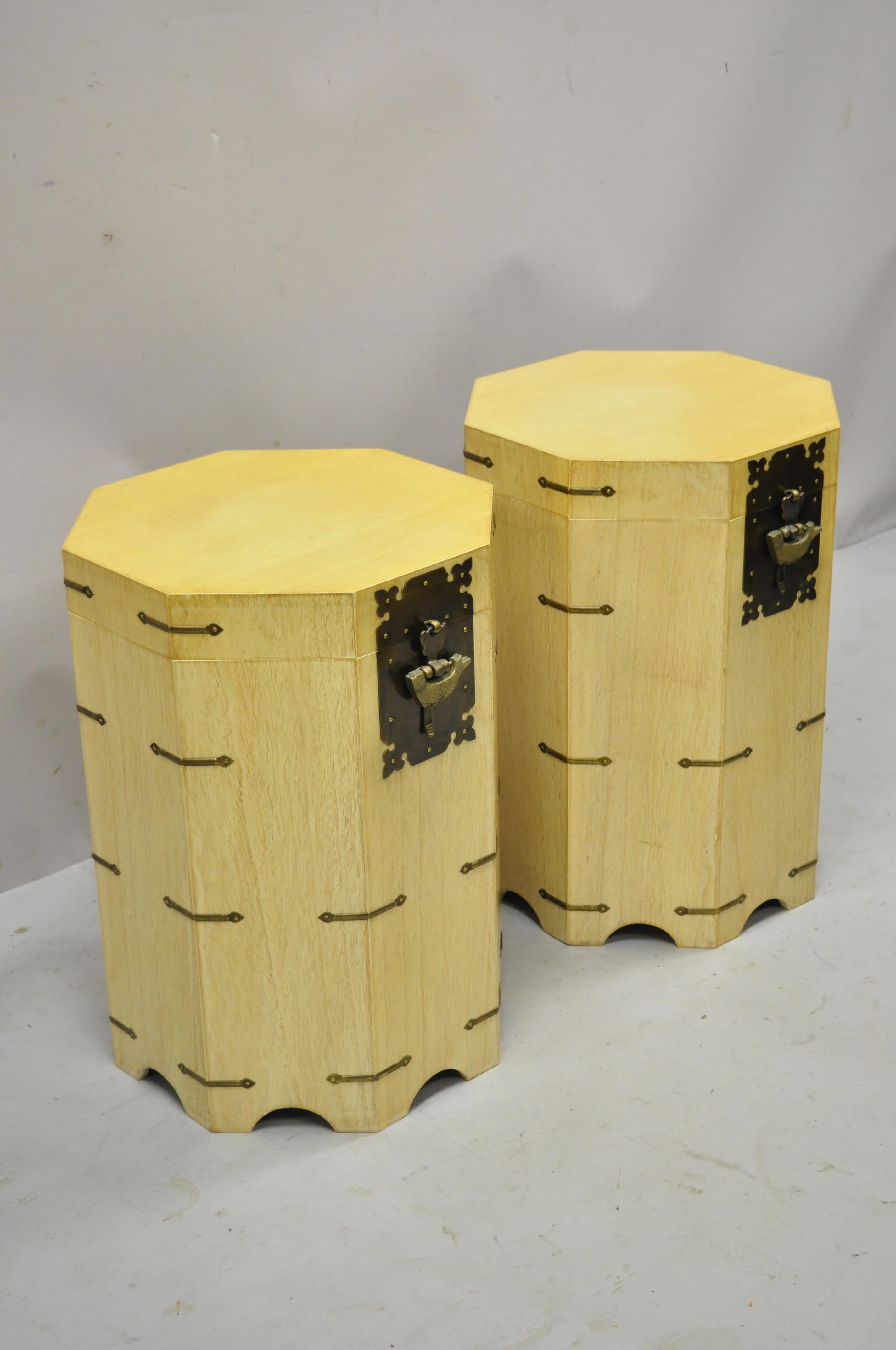 Vintage cerused mahogany Chinese storage chest trunk octagonal side tables - a pair. Item features cerused mahogany finish brass accents, lift top with decorated interior, brass fish locks on both trunks, working lock and key, very nice vintage