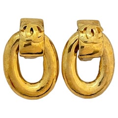 Vintage Vtg CHANEL CC logo Made in France gold door knocker clip on earrings