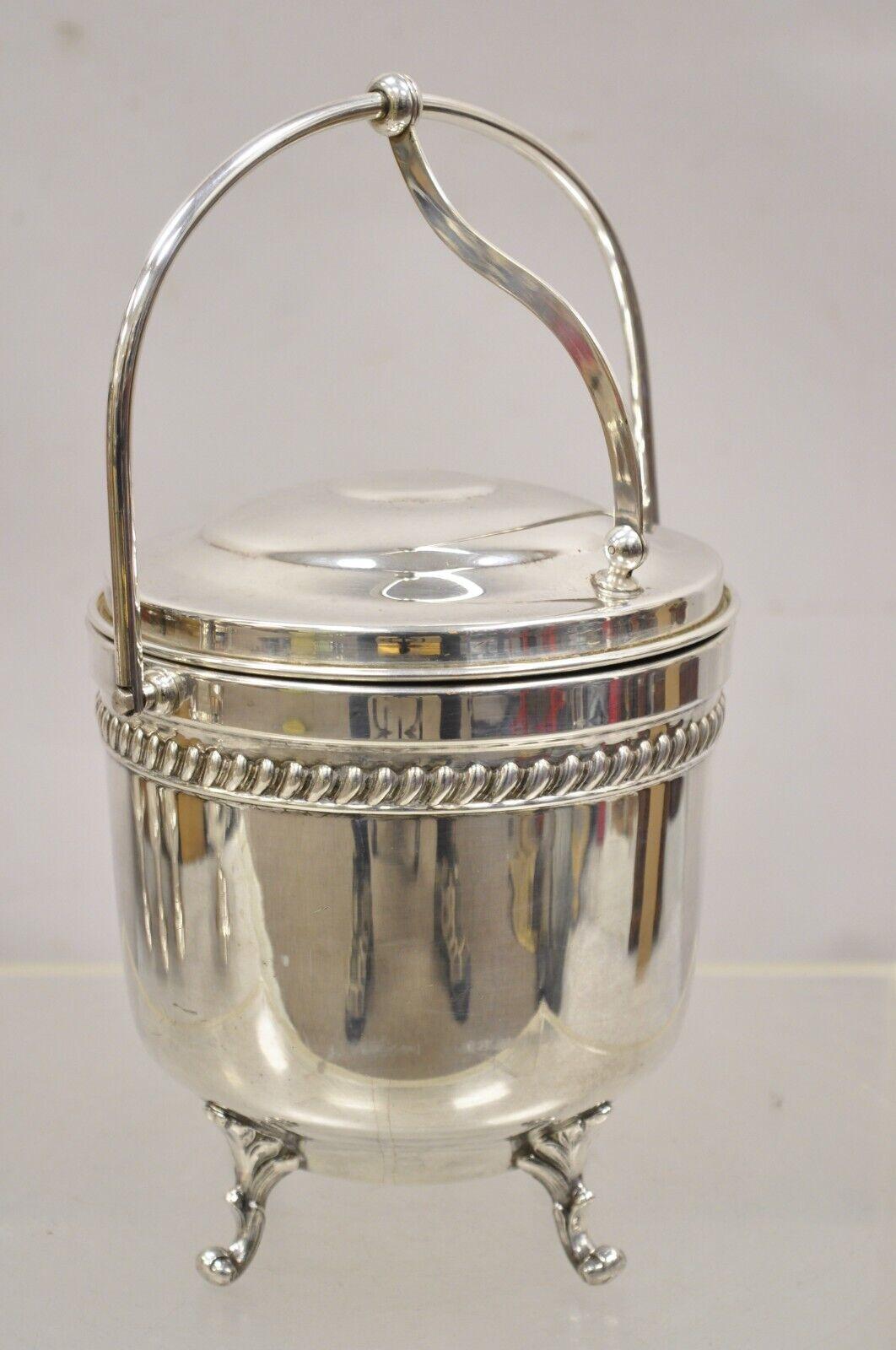 Vintage English Sheffield Silver Plated Reticulated Hinged Handle Lidded Ice Bucket with Glass Liner. Circa Mid to Late 20th Century
Measurements:  13