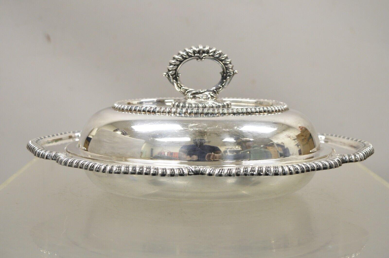 Vintage English Victorian Silver Plated Oval Lidded Vegetable Serving Platter Dish. Item featured has a nice oval form, ornate handle, very nice vintage item, great style and form. Circa Early to Mid 20th Century. Measurements: 5.5