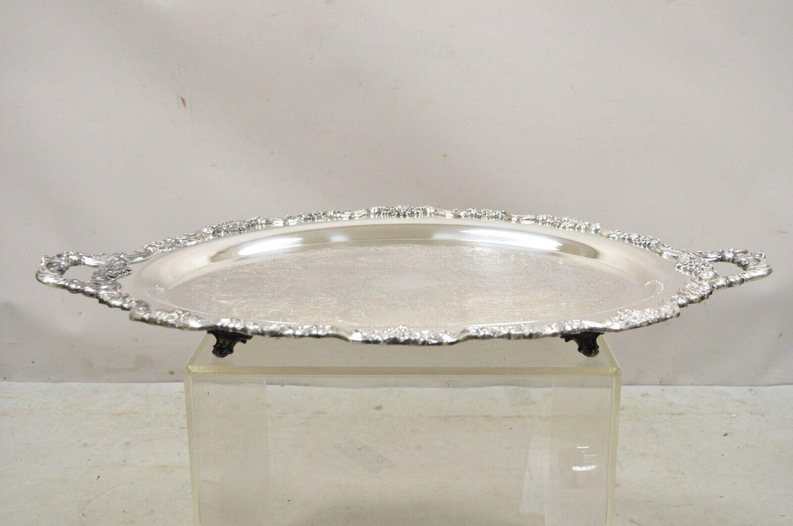 Vintage EPCA Poole Silver Co 400 Lancaster Rose Silver Plated Serving Platter Tray Item is raised on feet, ornate twin handles, etch decorated center, original hallmark, very nice vintage item, great style and form. 
Circa Mid 20th Century.