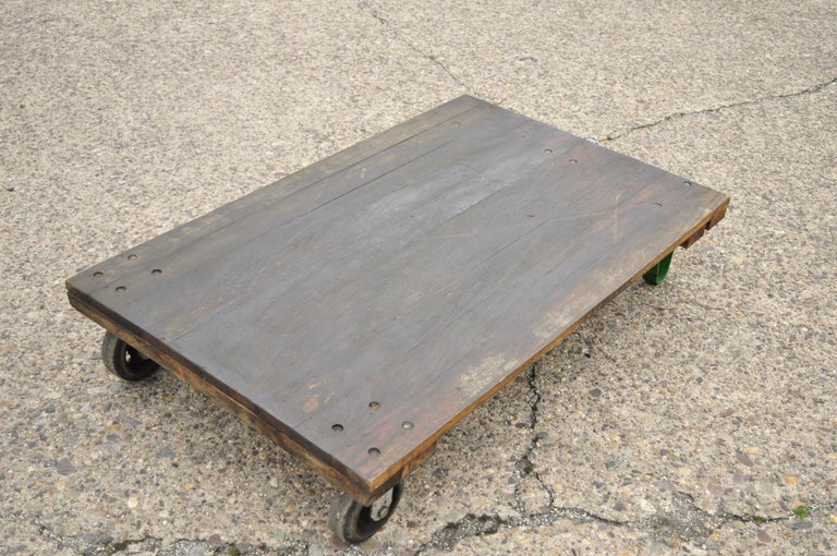 Vintage Fairbanks American industrial wood and iron factory work cart coffee table (B). Listing is per table. Listing includes a low sleek form, cast iron legs, 2 rubber wheel casters, great authentic patina, solid wood construction. Fresh from the